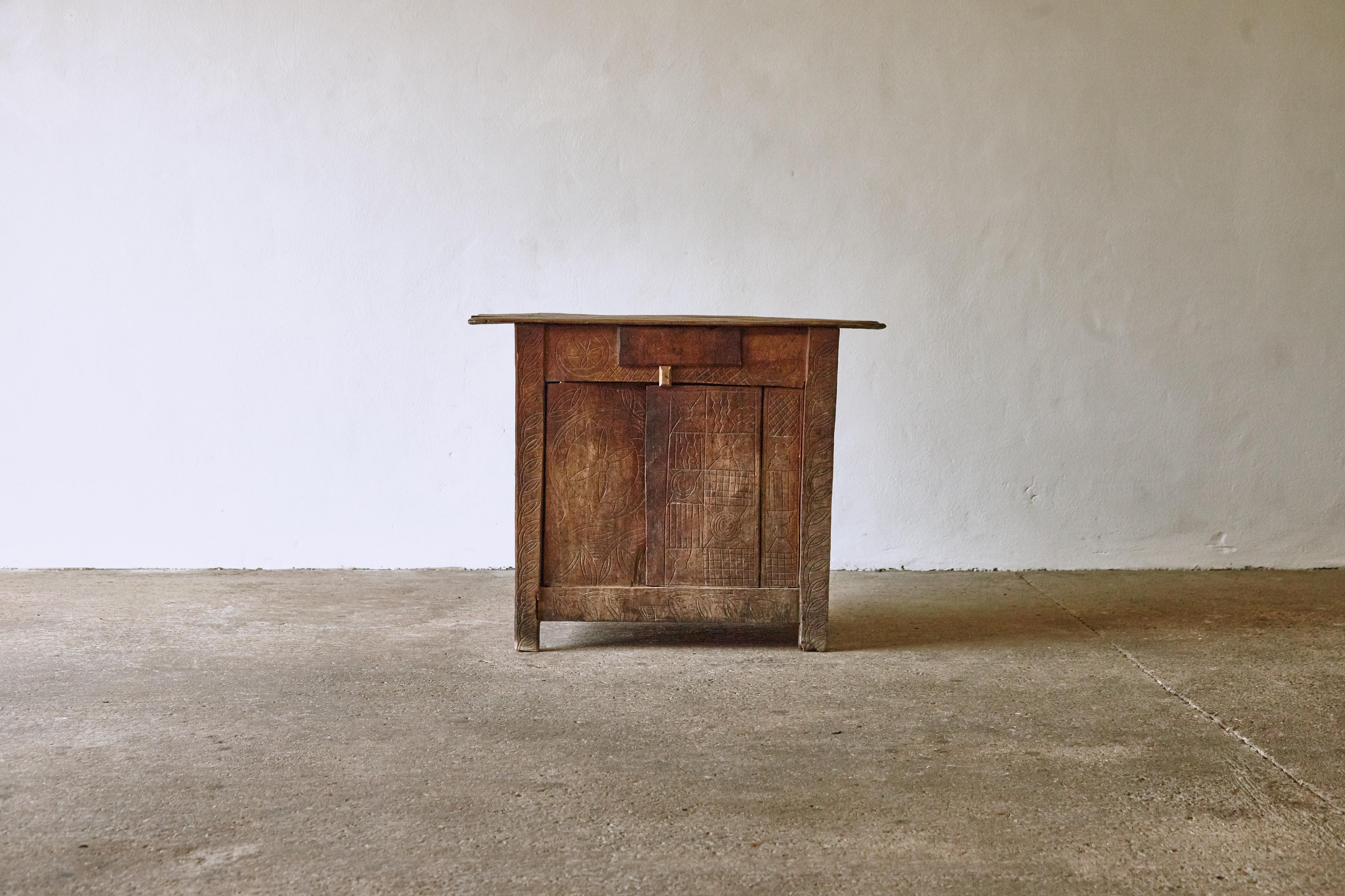 Unusual and unique Primitive Transylvanian cabinet. Hand carved doors. Anonymous maker, 19th century. Structurally sound, but probably not suitable for heavy use.   Fast shipping worldwide.




UK customers please note:    displayed prices do not