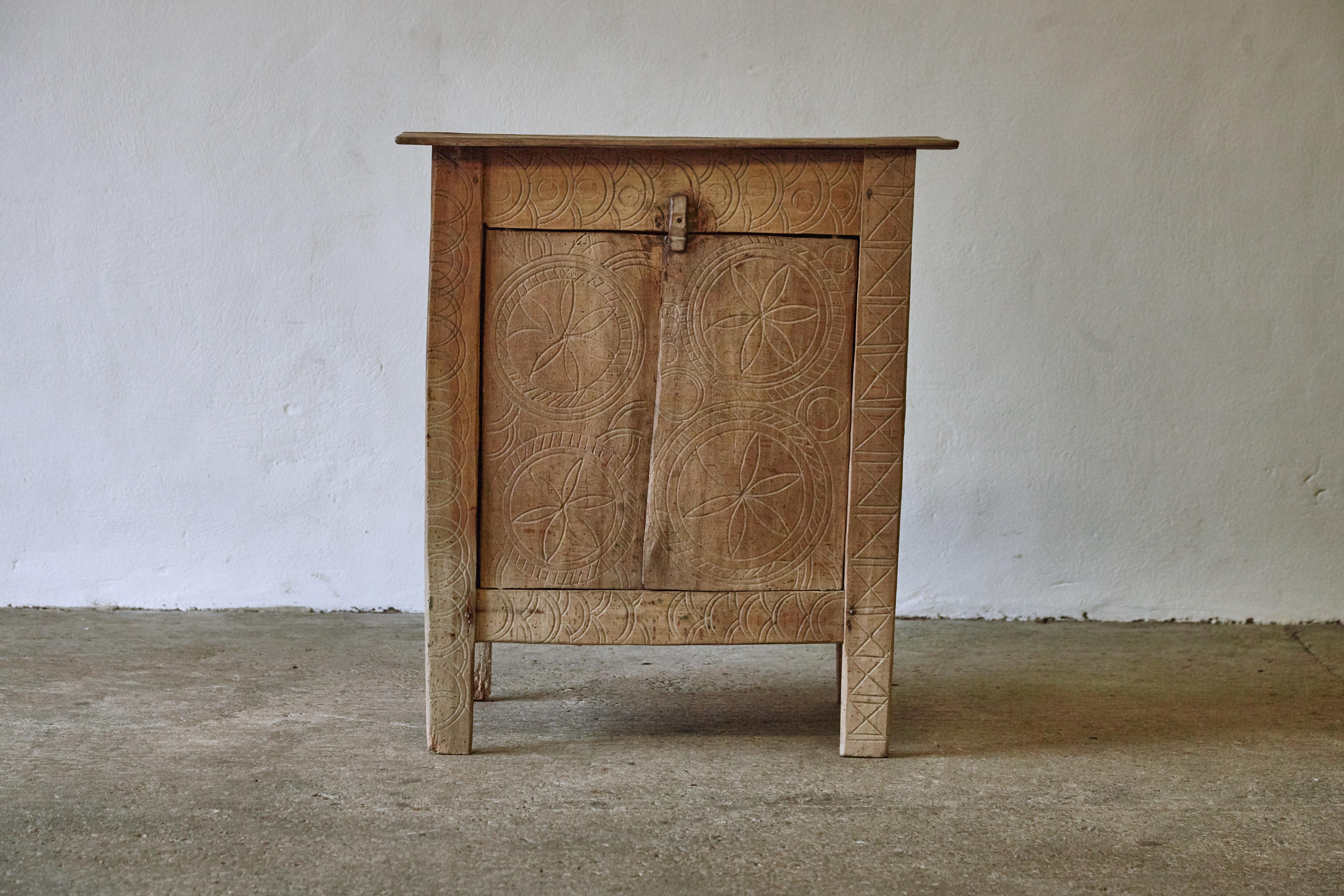 Unusual and unique primitive Transylvanian cabinet. Hand carved doors. Anonymous maker, 19th century. Structurally sound, but probably not suitable for heavy use.   Fast shipping worldwide.




UK customers please note:    displayed prices do not