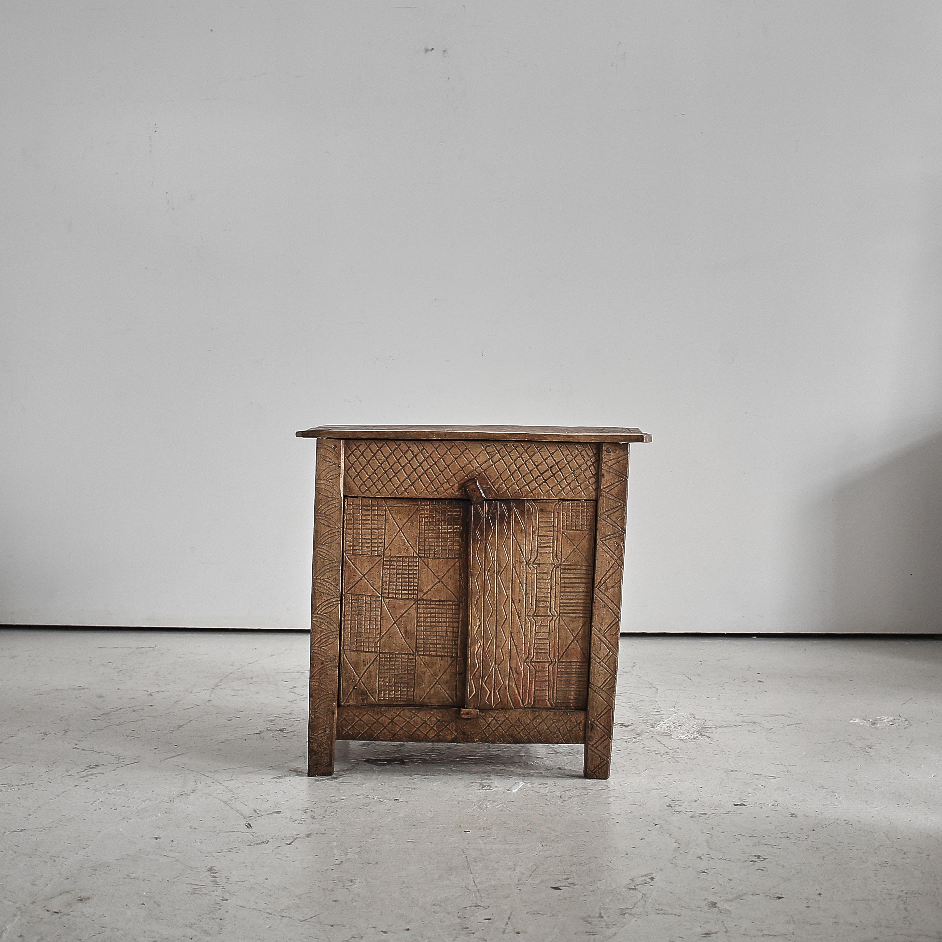 An early 19th C. Transylvanian mountain cupboard.

Heavily patinated hewn beech with carved detailing (Klan markings) to the front.

One interior shelf.