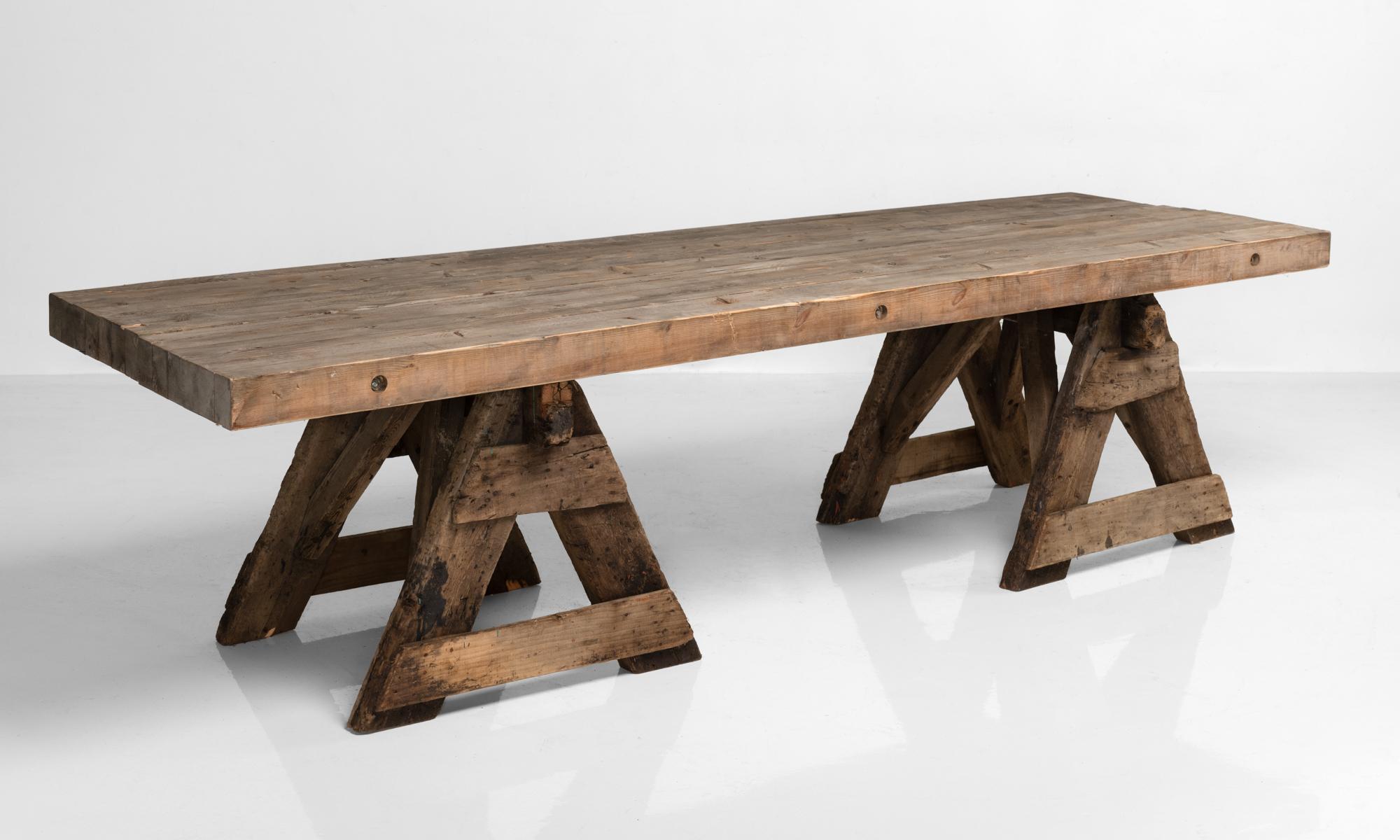 Primitive Work / Dining Trestle Table, France, circa 1930

Large, rustic form with sawhorse legs and top made of multiple segments of wood.