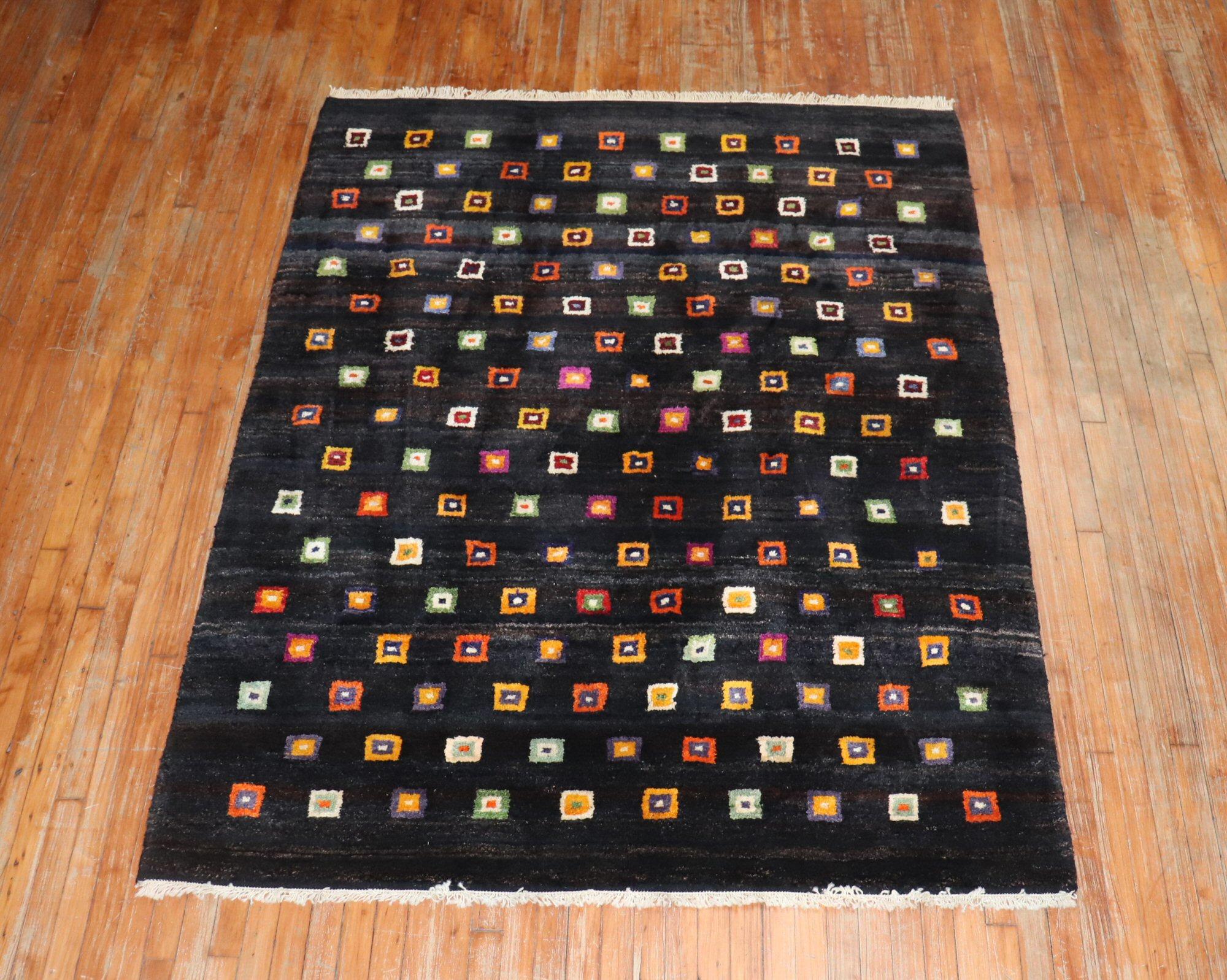 One of a kind Turkish contemporary wool rug with a colorful all-over box square pattern on a black ground.
Make a splash

Measures: 5'8” x 7'6”.
  