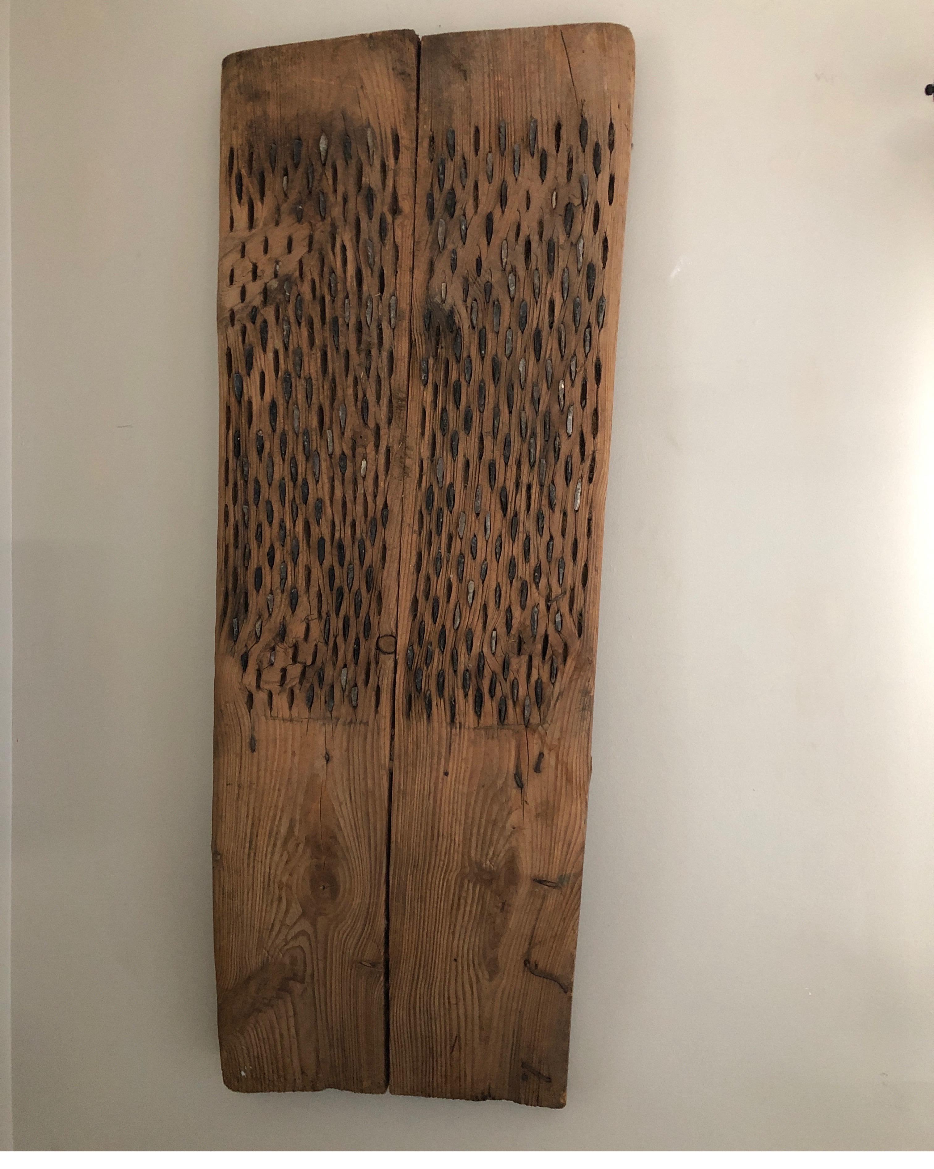 Tall primitive threshing board.
Measures 62.5 H x 25 at top 20 D at bottom x 5 inch D
Two pieces of wood along the back. One near the top and one near the bottom to assist in hanging in a wall.
Unique one of a kind handmade piece used by Turkish