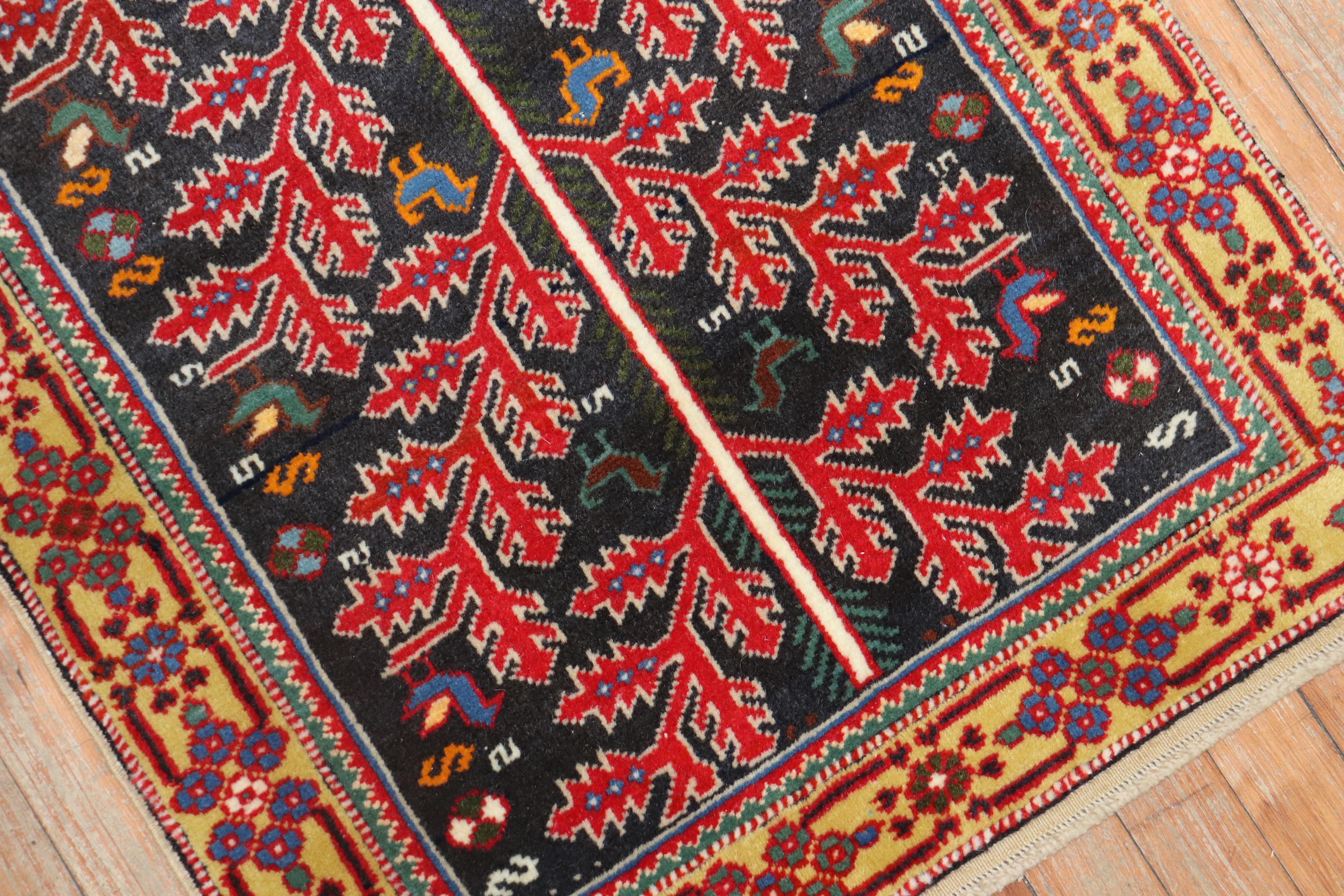 Mid-20th century Persian rug with a colorful Primitive all-over design on a dark background

 Measures: 2'3