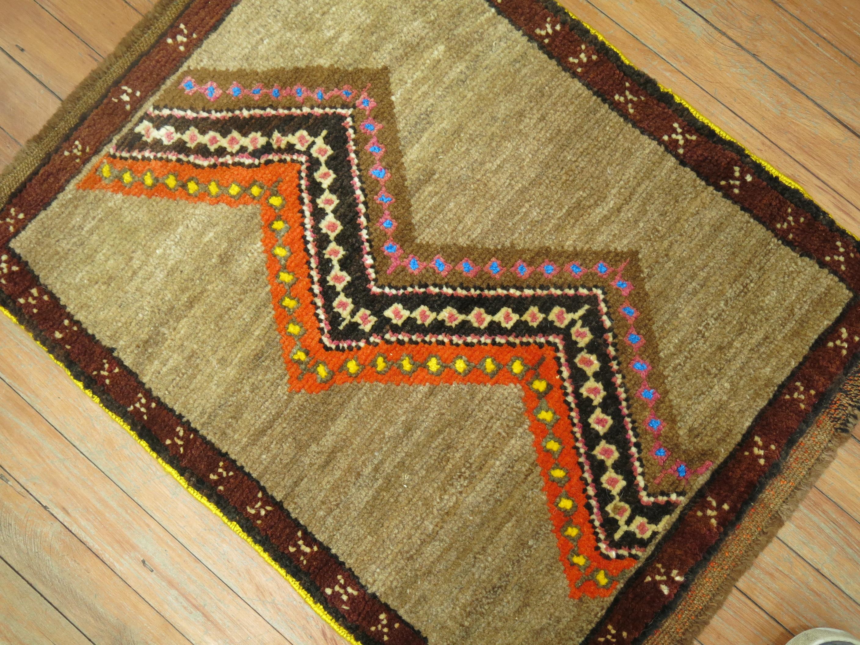 One of a kind vintage Turkish throw rug with a wavy primitive design on a brown field.

1'1'' x 2'6''