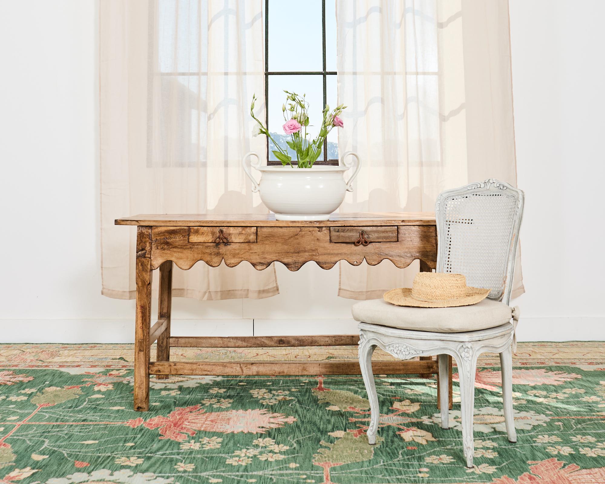 Gorgeous walnut hardwood center table or console table made in a rustic primitive style. The table features a 1