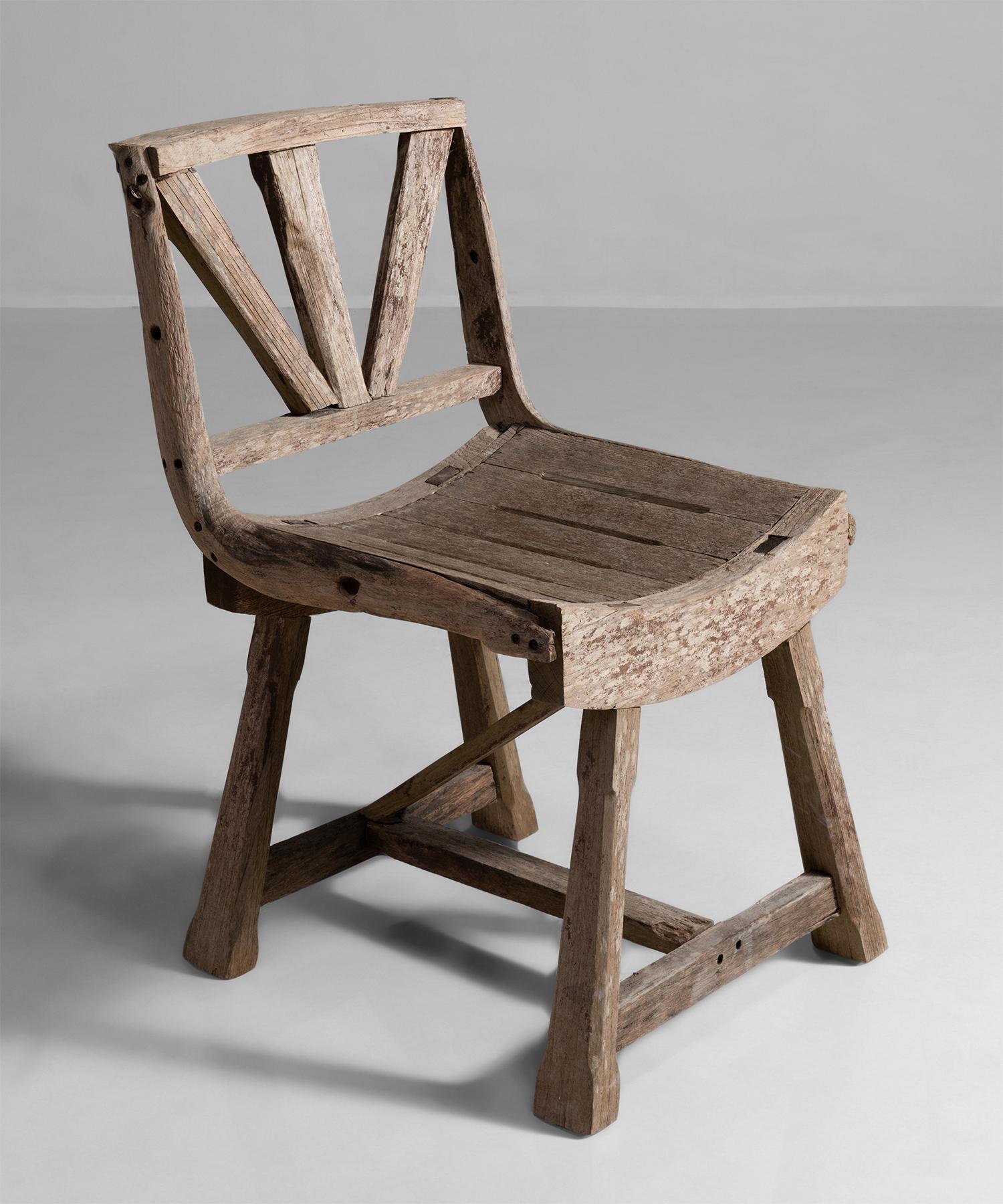 Primitive Weathered oak chair, England, circa 1910

Weathered sculptural seat, unique form, with handsome pale patina.