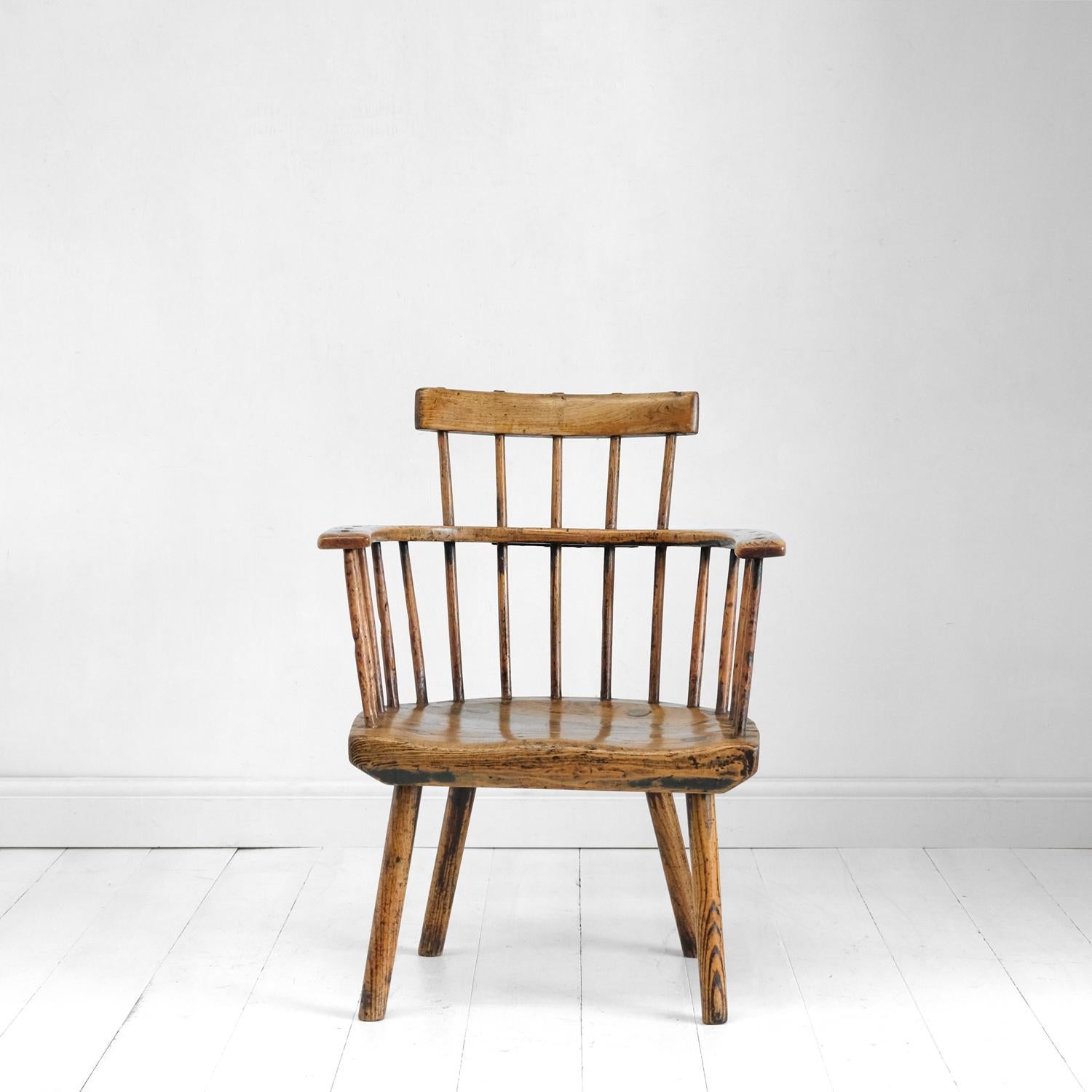 A rare and beautiful yet robust primitive Welsh stick chair in a sumptuous pale colour. One can’t help but notice the huge slab of ash forming the seat and upon which this chair is constructed. It’s roughly 3 inches thick and has a subtle saddle