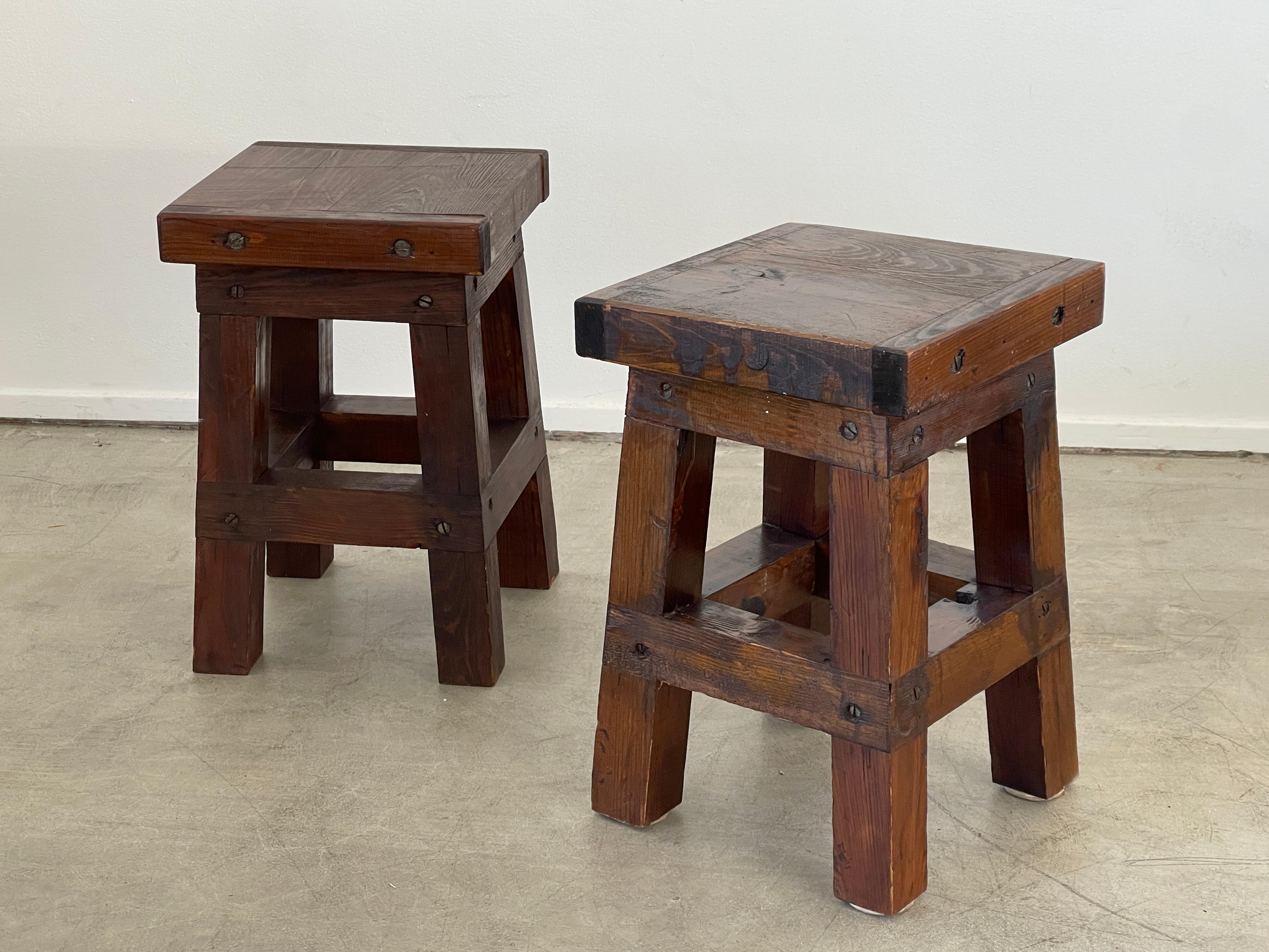 Industrial primitive stools with thick slabs of wood and great patina 
Joints and hardware add to simple design.

Great as nightstands or end tables 