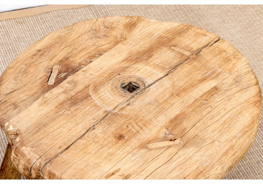 20ième siècle Primitive Wood Table With Antique Wheel Top en vente
