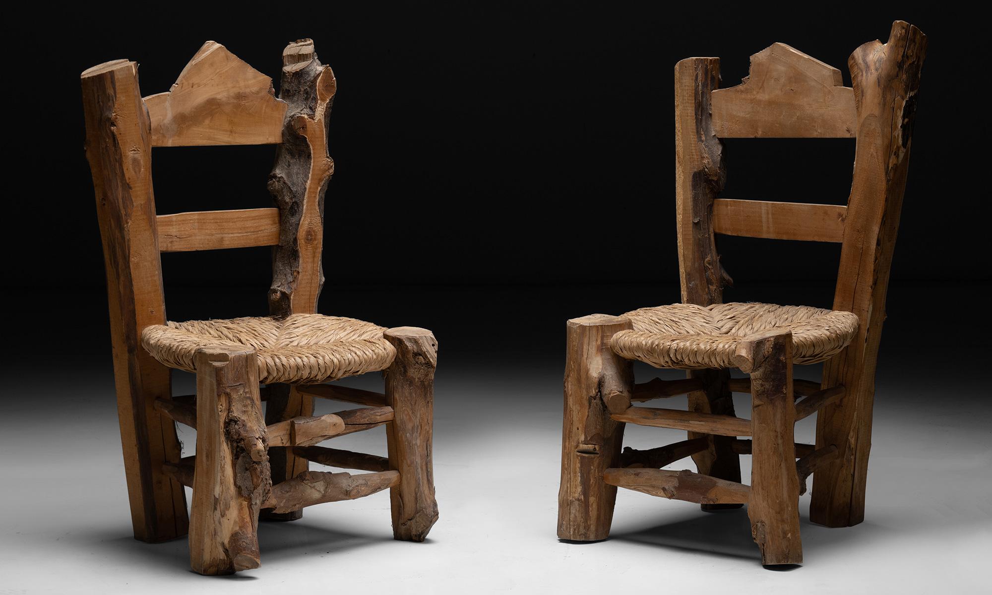 Primitive wooden chairs.

France circa 1960

Hewn wooden chairs with wicker seats.

LEFT: 21.5”W x 18.5”D x 37”H x 16.25” seat 

RIGHT: 21.25”W x 17.5”D x 38.25”H x 16.5”seat.