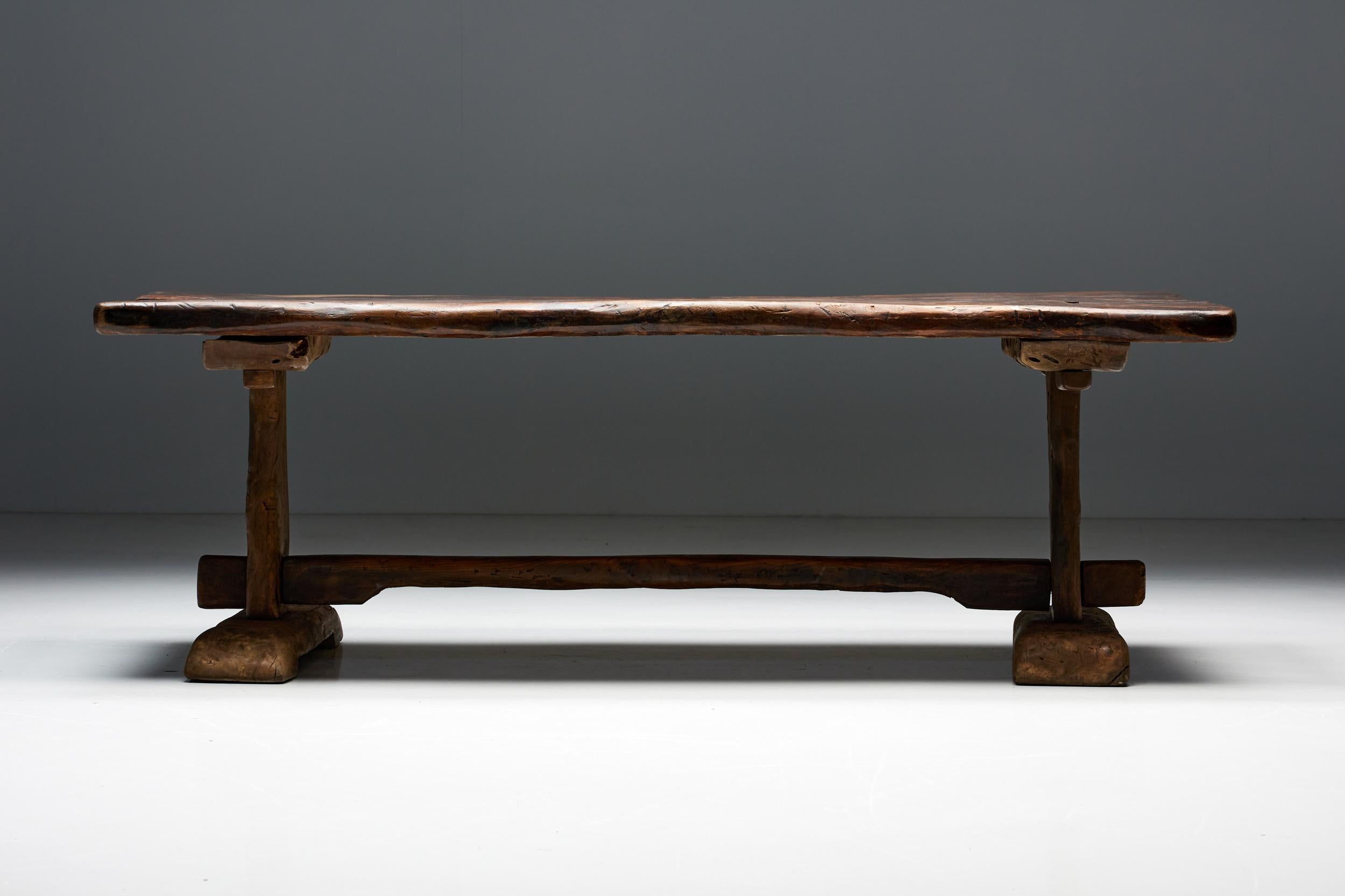 Monoxylite; Rustic; Wabi Sabi; Wooden Bench; Axel Vervoordt; France; Early 20th Century; 

Primitive wooden dining table, handcrafted from the finest dark wood of the early 20th century, the perfect addition to any wabi-sabi style interior. Its