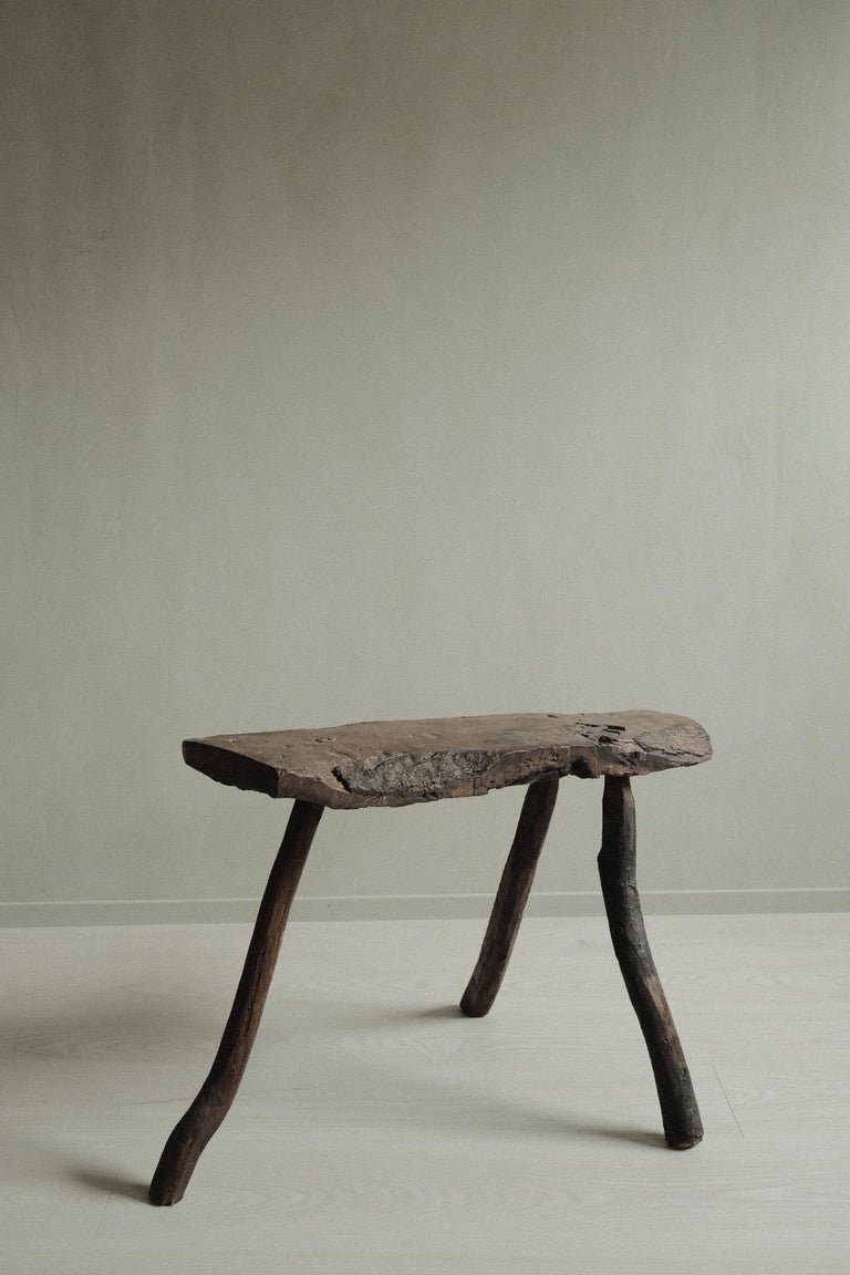 Unique wooden hand crafted stool or side table from Spain, c. 1800s. This beautiful wabi sabi piece reflects a warm and cosy feeling, ideal to give your interior extra character.