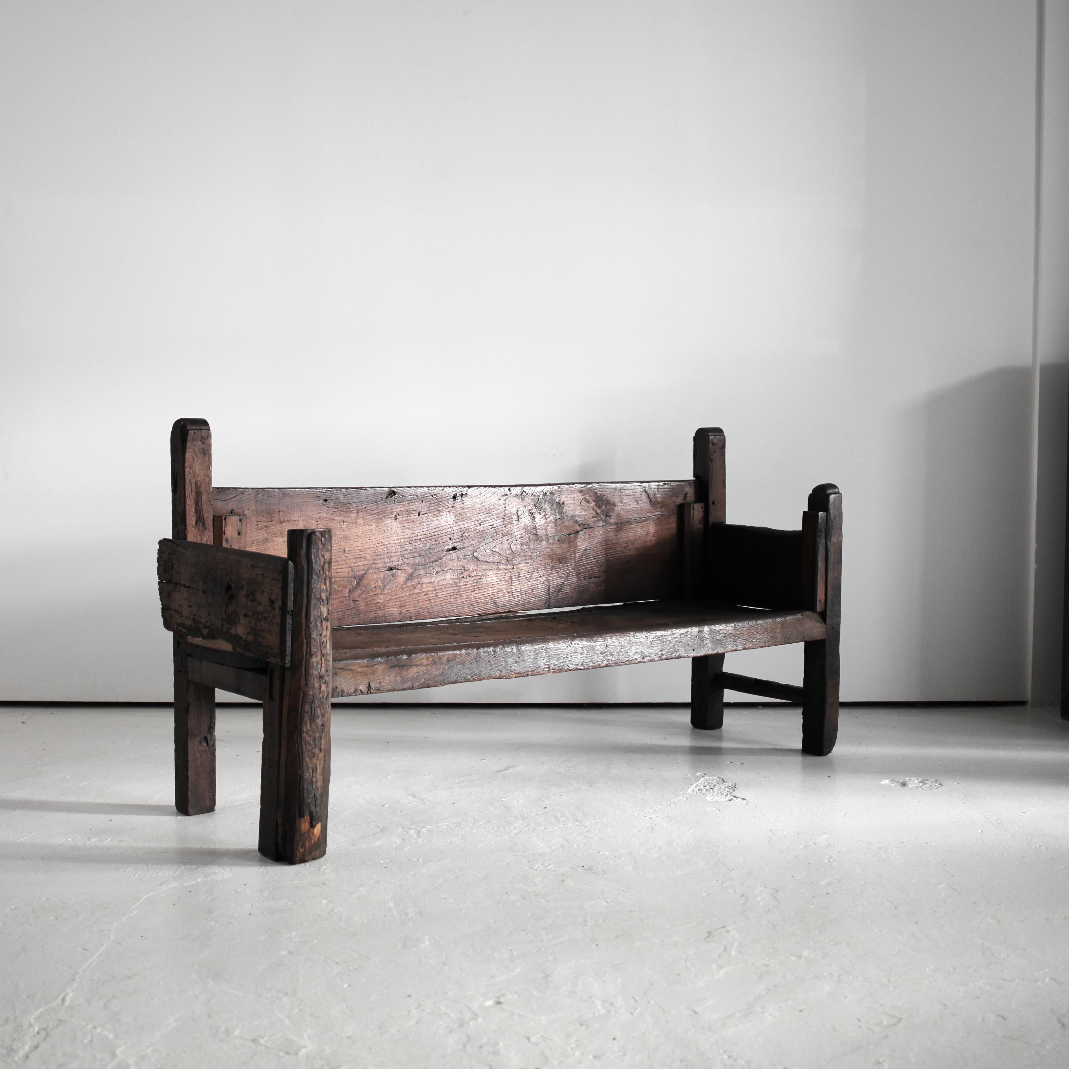 A large hewn chestnut 18th C. bench from Braga, northern Portugal.

Heavily patinated with many age old repairs.