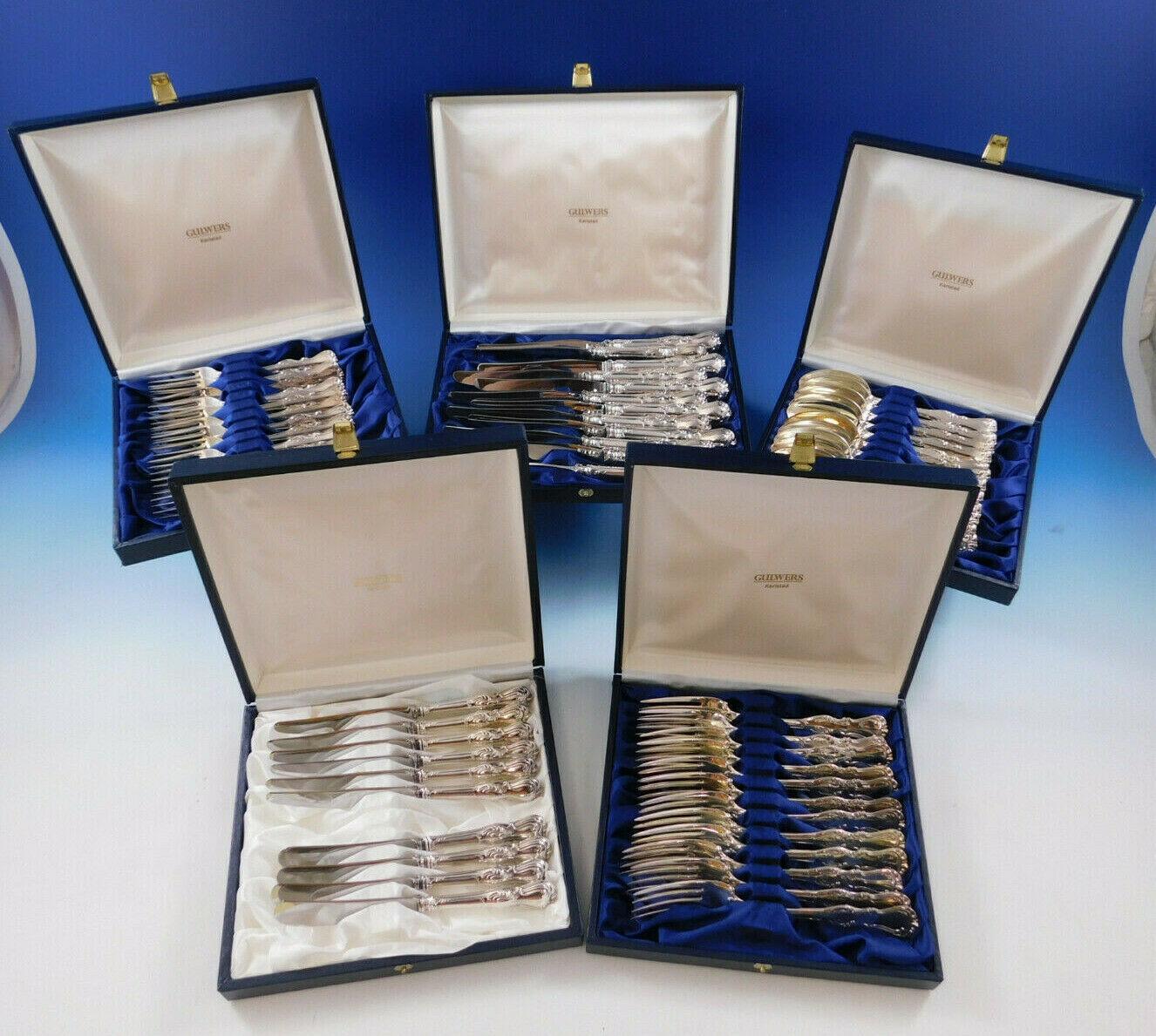 Prince Albert by C.G Hallberg (Swedish-Stockholm) 830 silver flatware set with fan and scroll detailing - 58 pieces. This set includes:

12 knives with stainless blades, 8 1/4