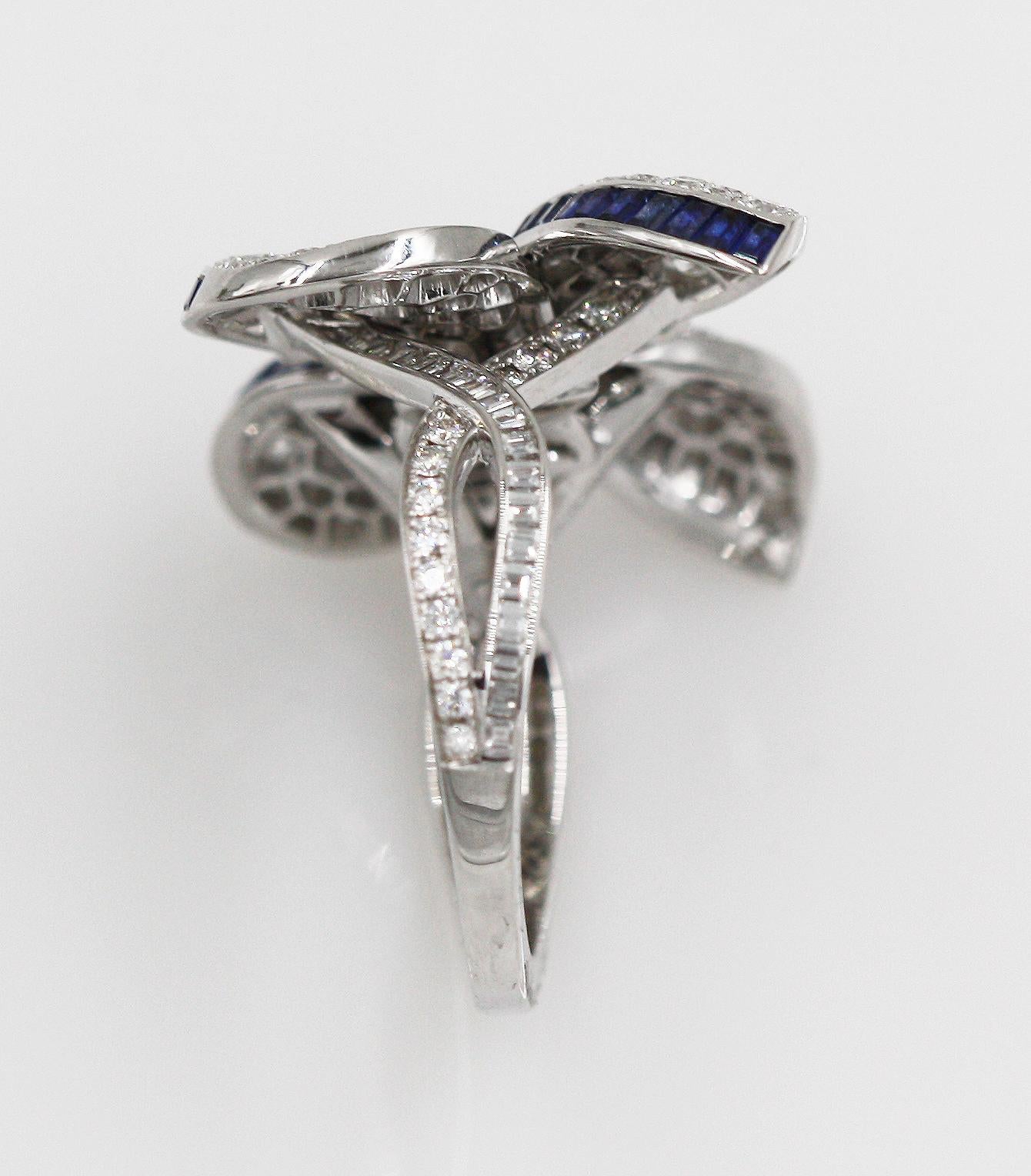 Ring Size: 50; US: 5.5 (This ring can resize by boutique).
34 Baguette Diamonds weighing approx. 0.35 Carats. 
139 Round Diamonds weighing approx. 1.75 Carats. Fine White. Clarity: VS+
48 Baguette Blue Sapphires weighing approx. 0.87 Carats.
Total