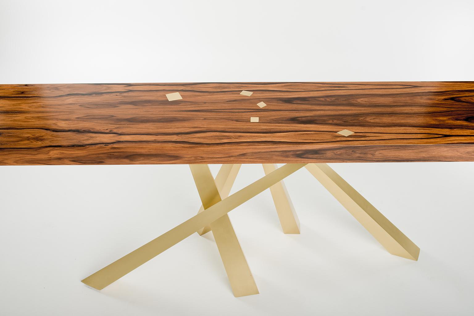 This beautiful table plays with the idea of balance and harmony while at the same time embracing a sense tension. The legs are precisely engineered to be perfectly stabile even though it feels almost as if they just happened to fall that