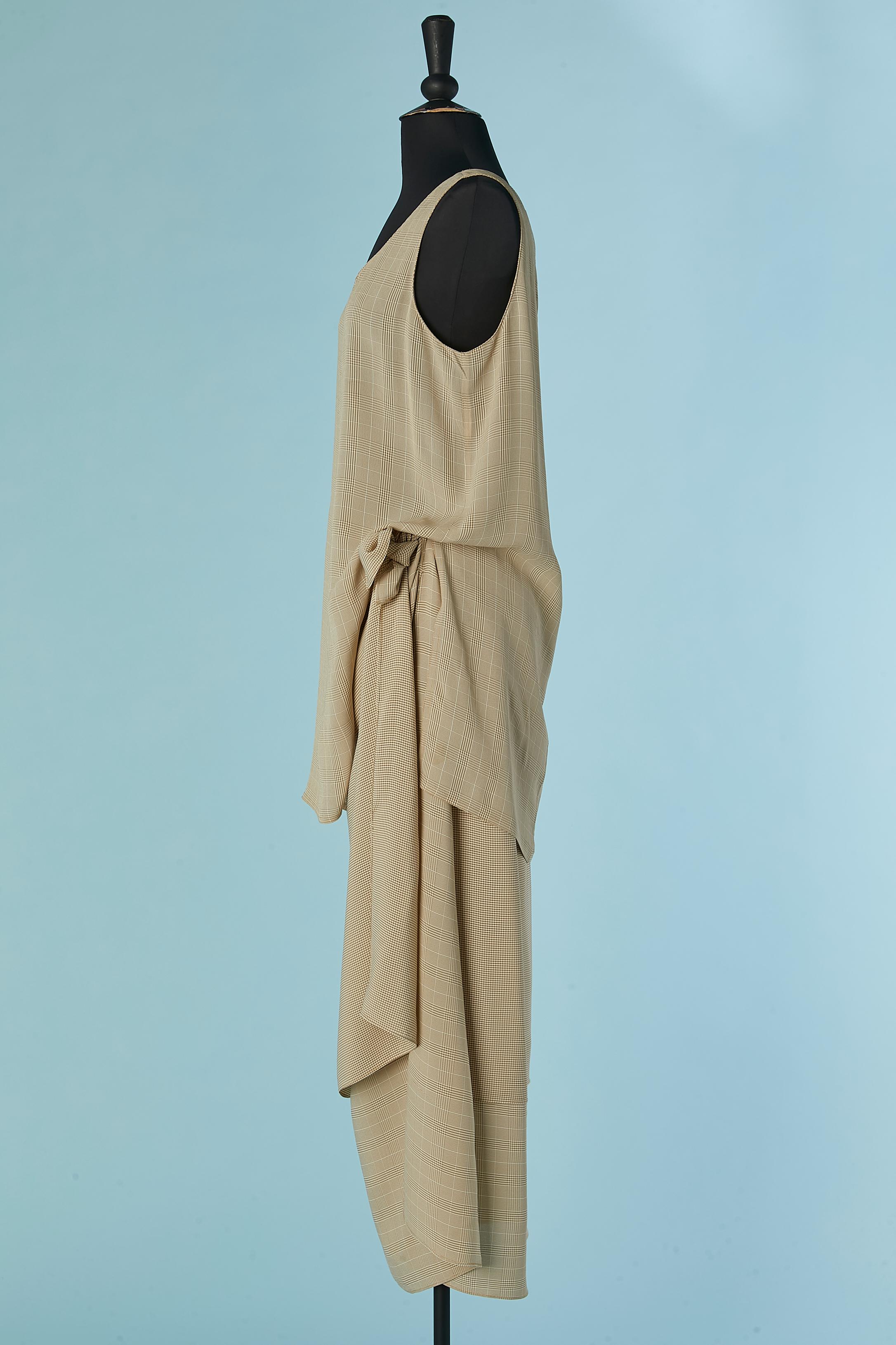Prince de Galles tank top and wrap skirt ensemble. Fabric composition: 50% acetate, 50% rayon. 
Split on both side on the tank top, lenght= 30cm
The skirt is made of 2 lays with different pattern ( small check for the top lay and Prince de galles