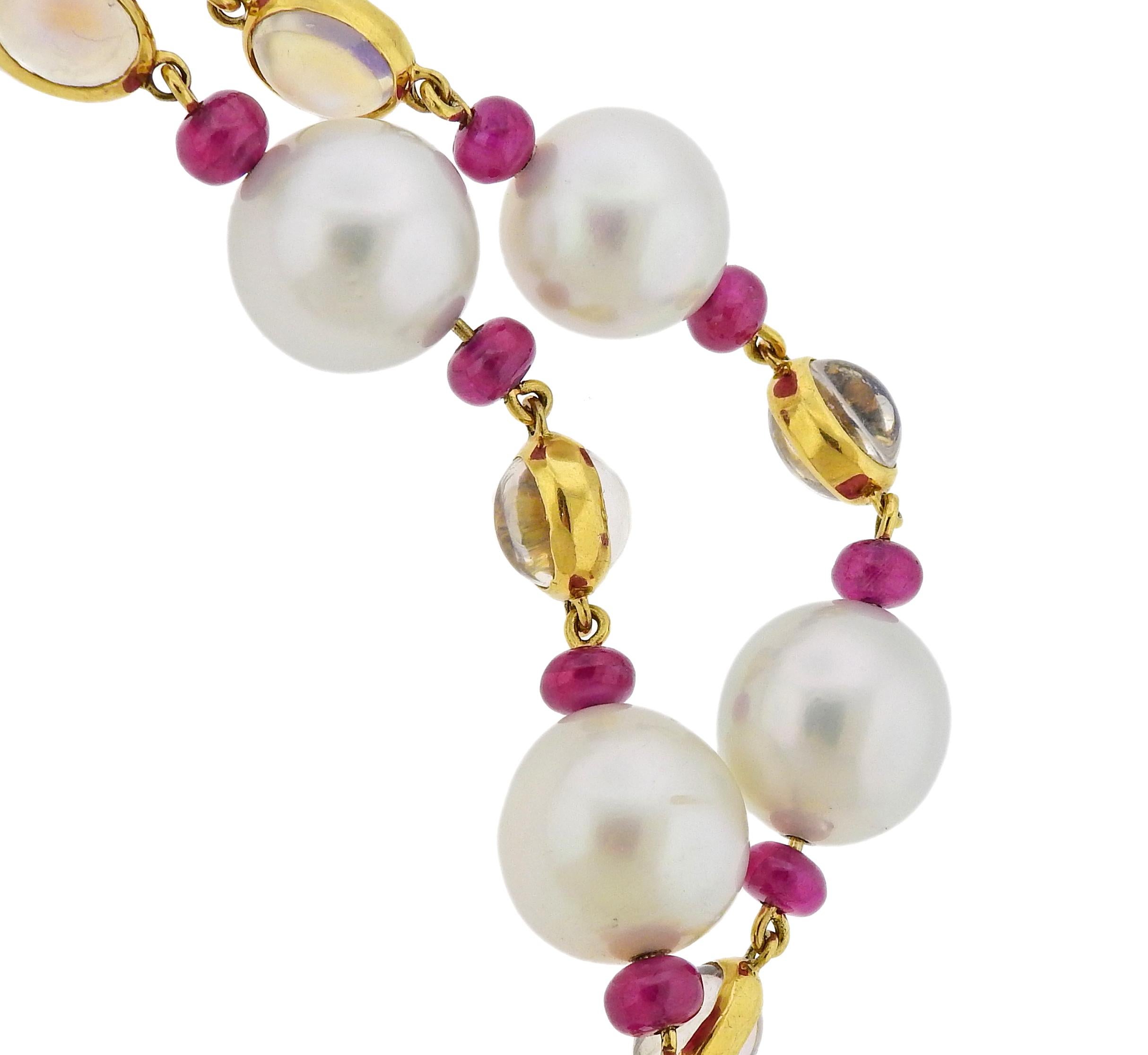 Impressive long 18k yellow gold necklace by Assael for Prince Dimitri, set with 81 carats in rubies, 65.16ctw in moonstones and approx. 13mm - 14mm. South Sea pearls. retail $55500. Necklace is 41