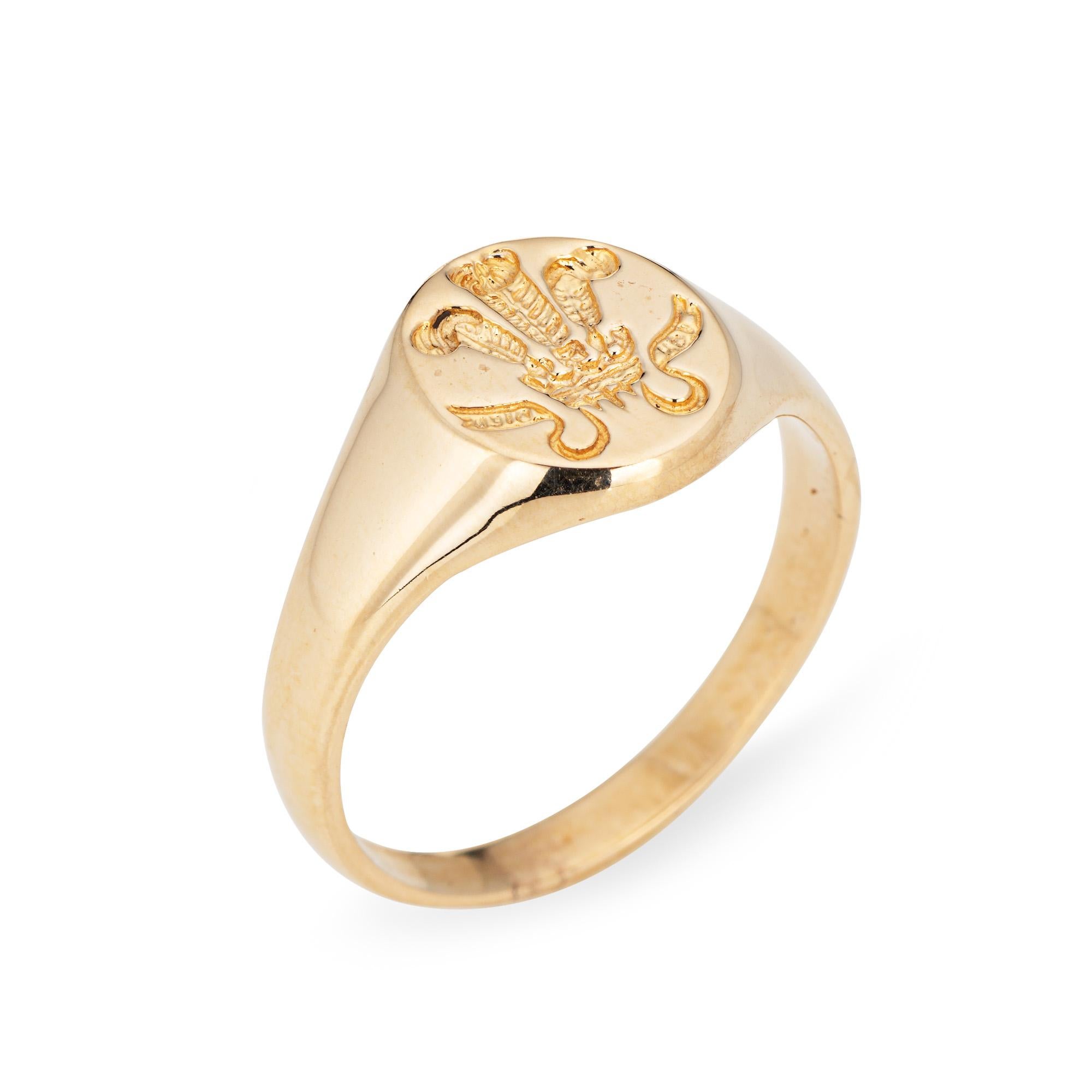 Finely detailed vintage Prince of Wales feathers signet ring crafted in 9 karat yellow gold. 

The signet ring depicts the Prince of Wales feathers, the heraldic badge of the Prince of Wales. It consists of three white feathers emerging from a gold