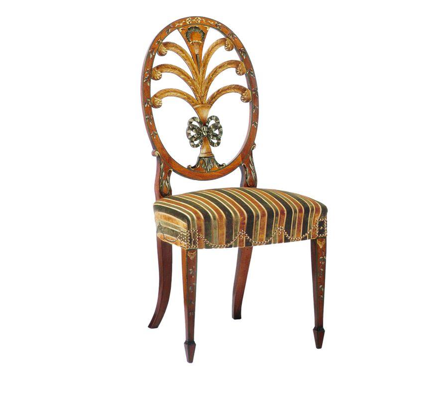 A statement-making piece that indulges in fancy hand-painted motives and decorative details, this chair reproduces an original Prince of Wales design dating back to circa 1800-1820. Delicate floral garlands accent the whole silhouette, comprising