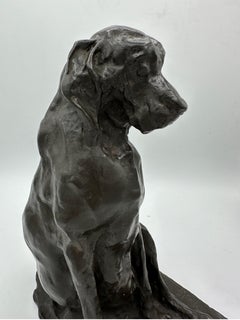 A late 19th century bronze animalier figure of a seated hound