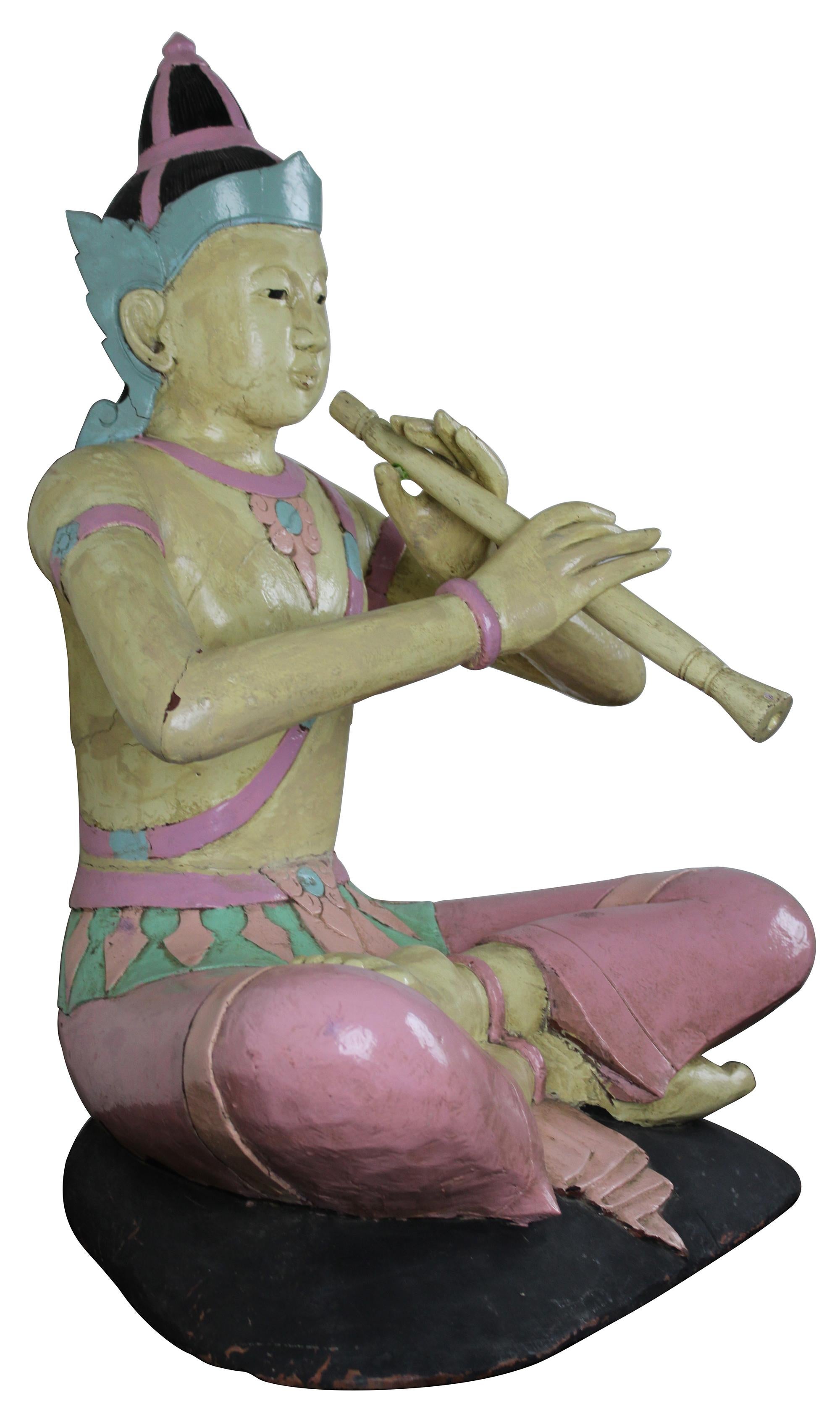 buddha playing flute