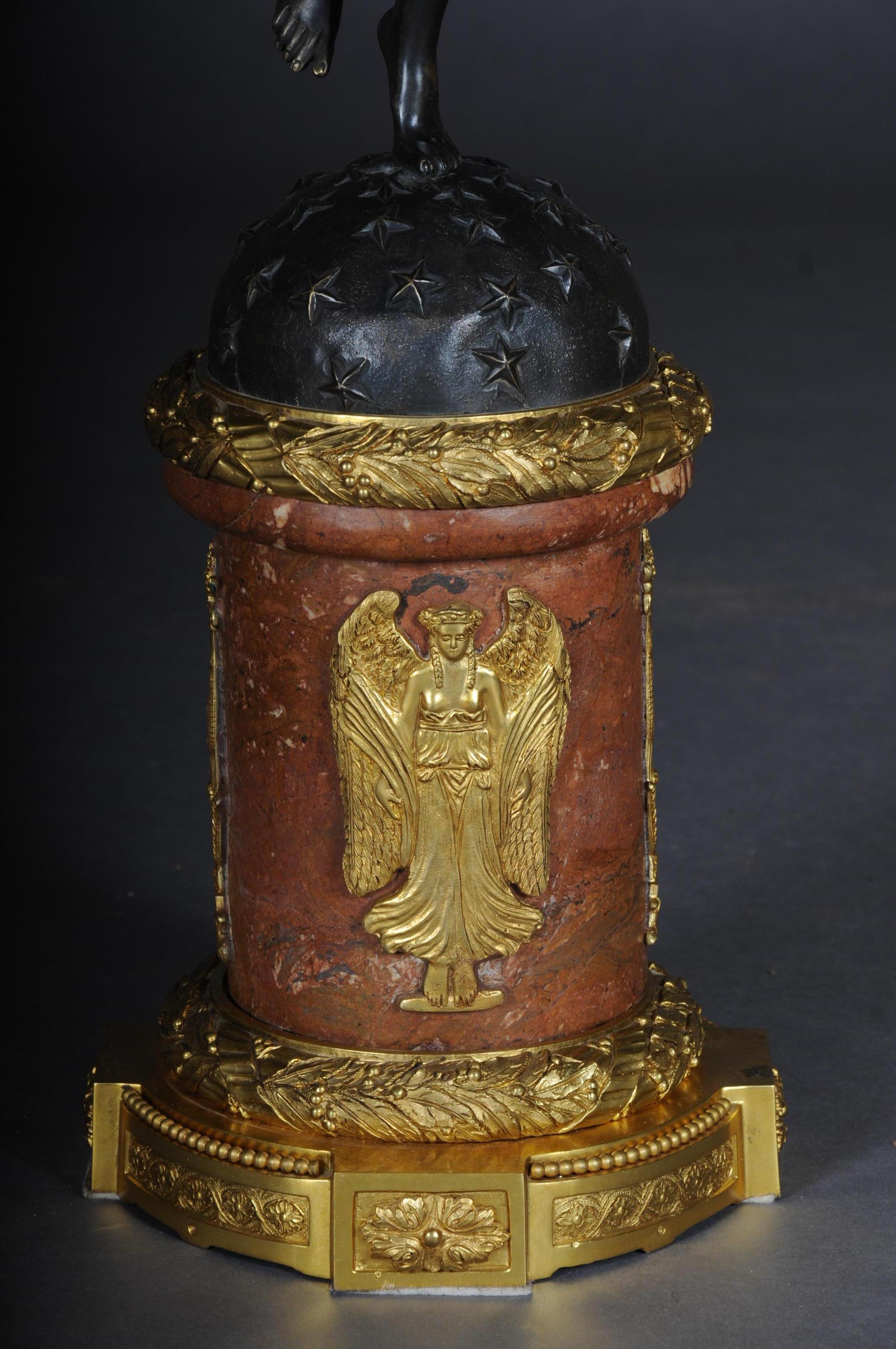 Extremely finely chased and cast bronze. Fully sculpted figures (Viktoria). Carrying on the head and supporting with the hands torch-shaped shaft with 12 cornucopia, curved lighthouses. This model is one of the most proportioned chandeliers.