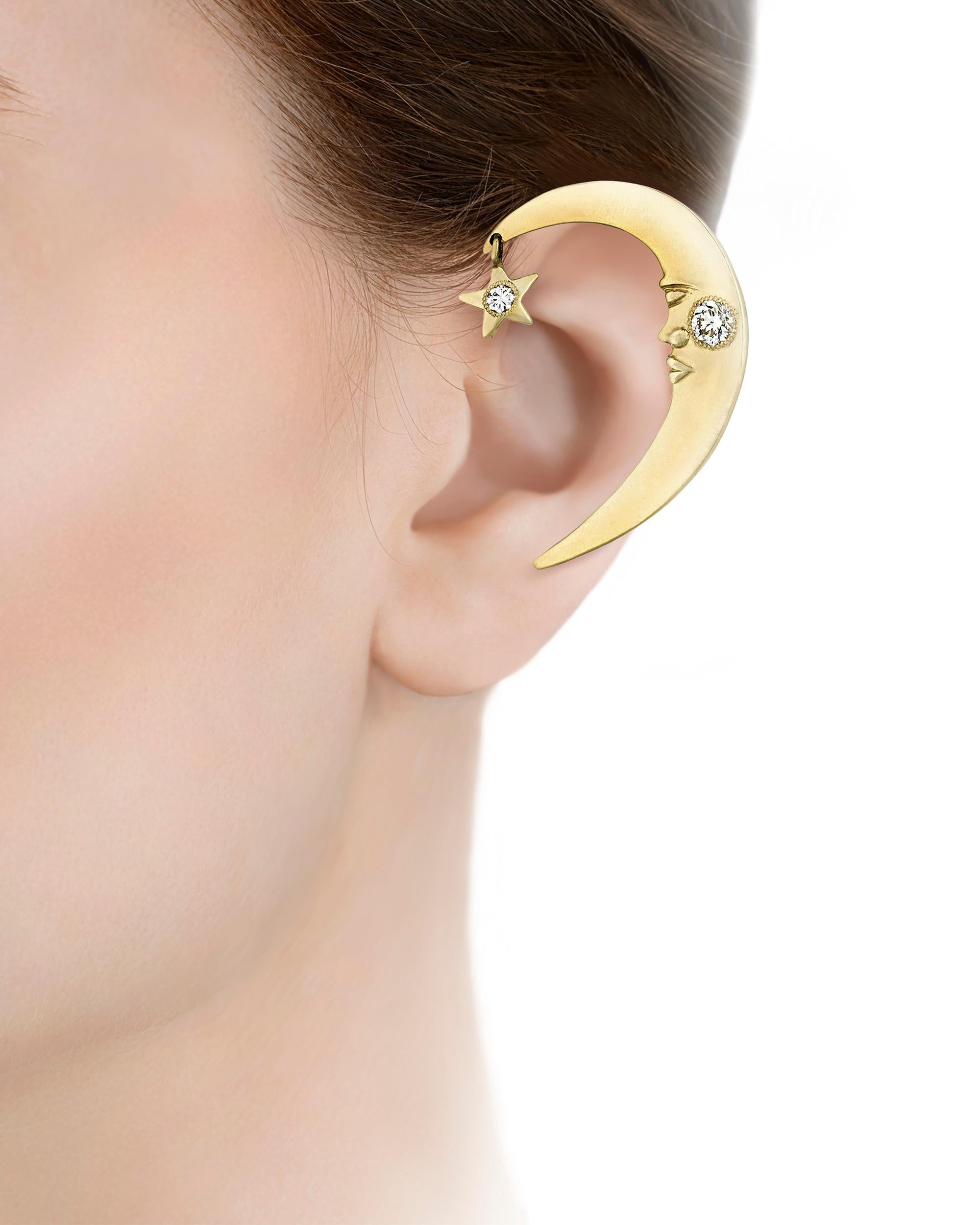 This imaginative ear cuff was once owned by the pop icon Prince and worn on stage during his performances throughout the 1990s. Taking the form of a crescent moon wearing a stoic expression, the 14K yellow gold cuff features 0.50 carat of white
