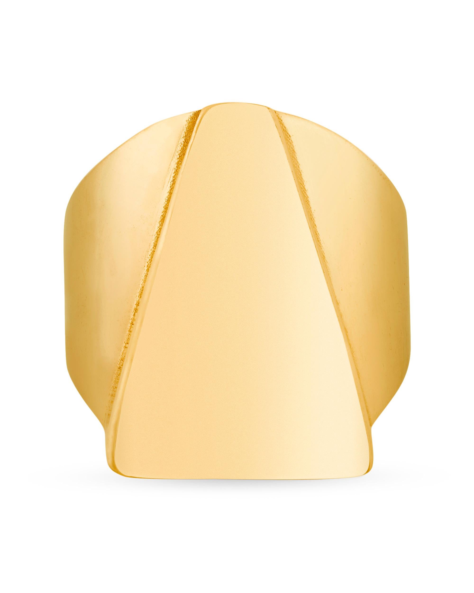 Sleek and statement-making, this 14K yellow gold ring was once owned by the pop musician Prince. Taking the shape of a stylized pyramid, the ring's minimalistic design includes a raised triangle atop a wide band. Worn by the Prince during his Act I