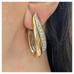 Créoles en or blanc et jaune 18k avec diamants princesses et baguettes