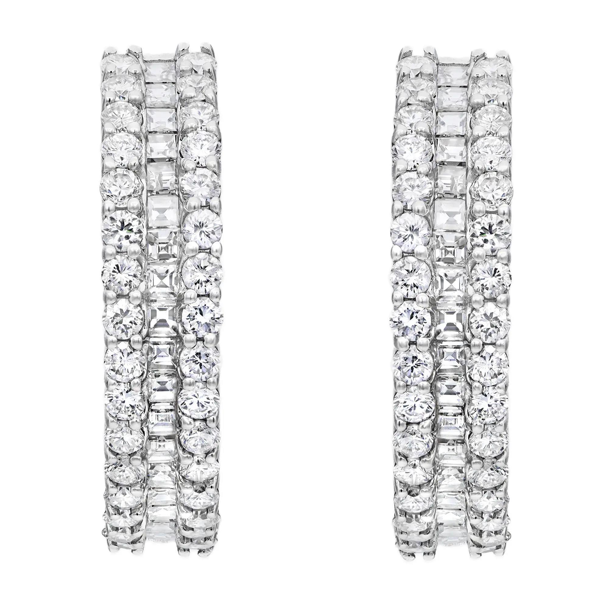 Sparkle all the way with these beautiful inside out diamond hoop earrings. Crafted in lustrous 14K white gold. These hoop earrings are lined with channel set princess cut diamonds in the center with an outline of prong set round cut diamonds. Total