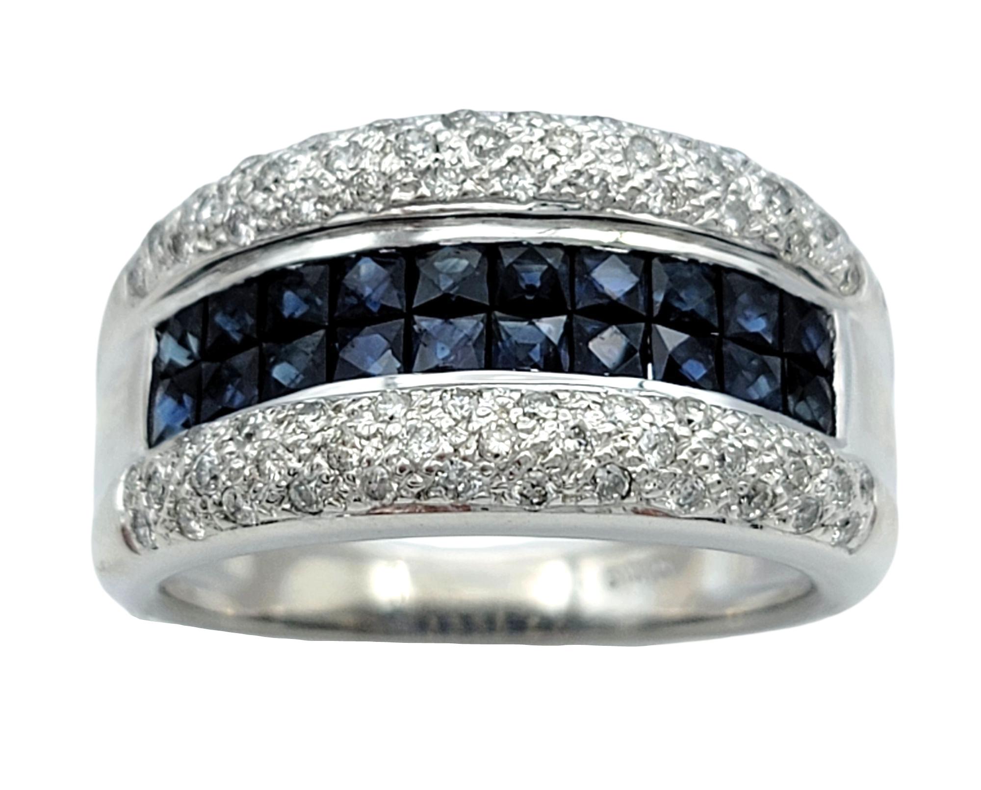 Ring Size: 8

This bold ring showcases a striking band of princess checkered-cut blue sapphires running through the center, bordered on both sides by rows of pavé-set round brilliant cut diamonds. The combination of geometric precision and brilliant
