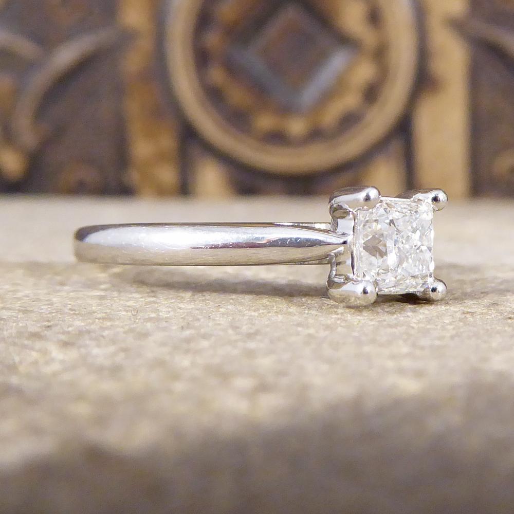 The perfect engagement ring has a lustrous sparkle. A beautiful clear and bright Princess Cut Diamond weighing 0.50ct sits in the centre of this ring, and looks beautiful sat on the finger set in platinum. Ring resizing options are available, please