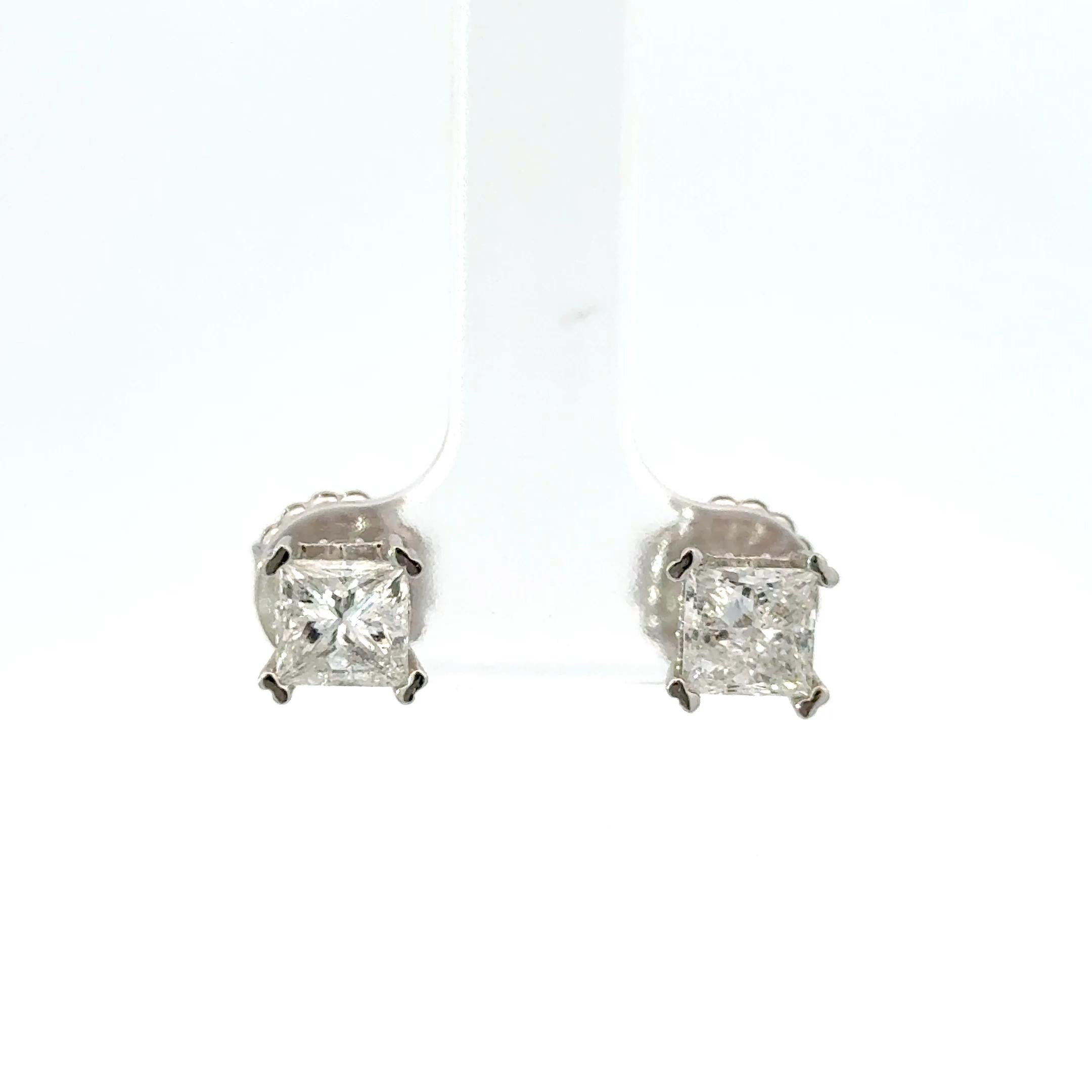 Princess Cut Diamond Studs in 14k White Gold. The diamonds are 2.04 in total carat weight, H to I color, I1 clarity.