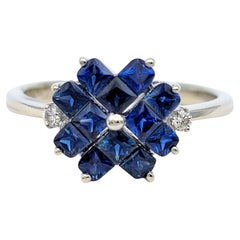 Blauer Saphir im Prinzessinnenschliff und Diamanten mit Blumenmotiv Ring aus 14 Karat Weißgold