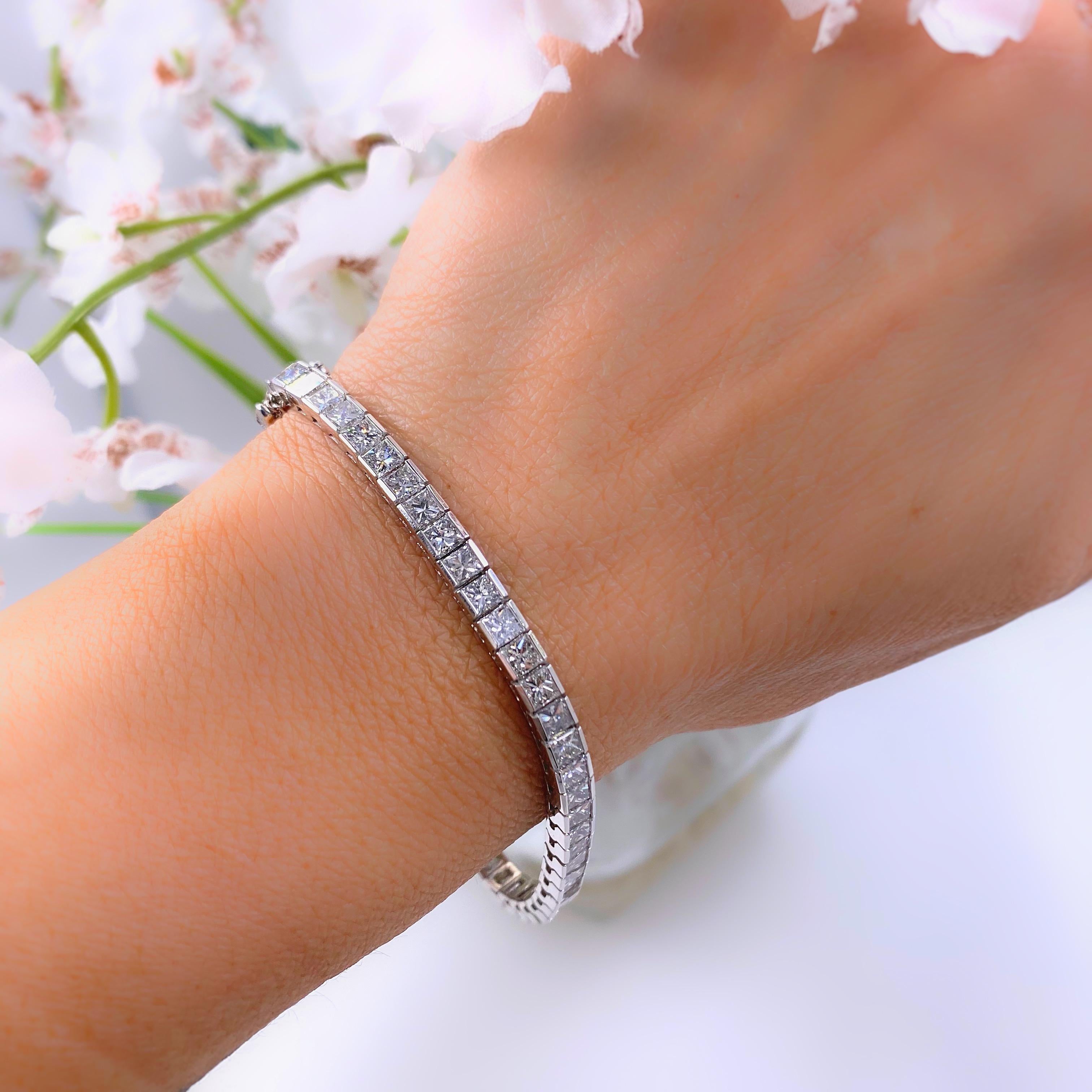 Diamond Bracelet
Style:  Tennis Bracelet
Metal:  14 Karat White Gold
Size / Measurements:  7.25'' long, 4.2 mm wide
TCW:  12 Carats Total Approximate
Diamonds:  56 Princess Cut Natural Diamonds
Color & Clarity:  H Color,  SI2-I1 Clarity
Hallmark: 