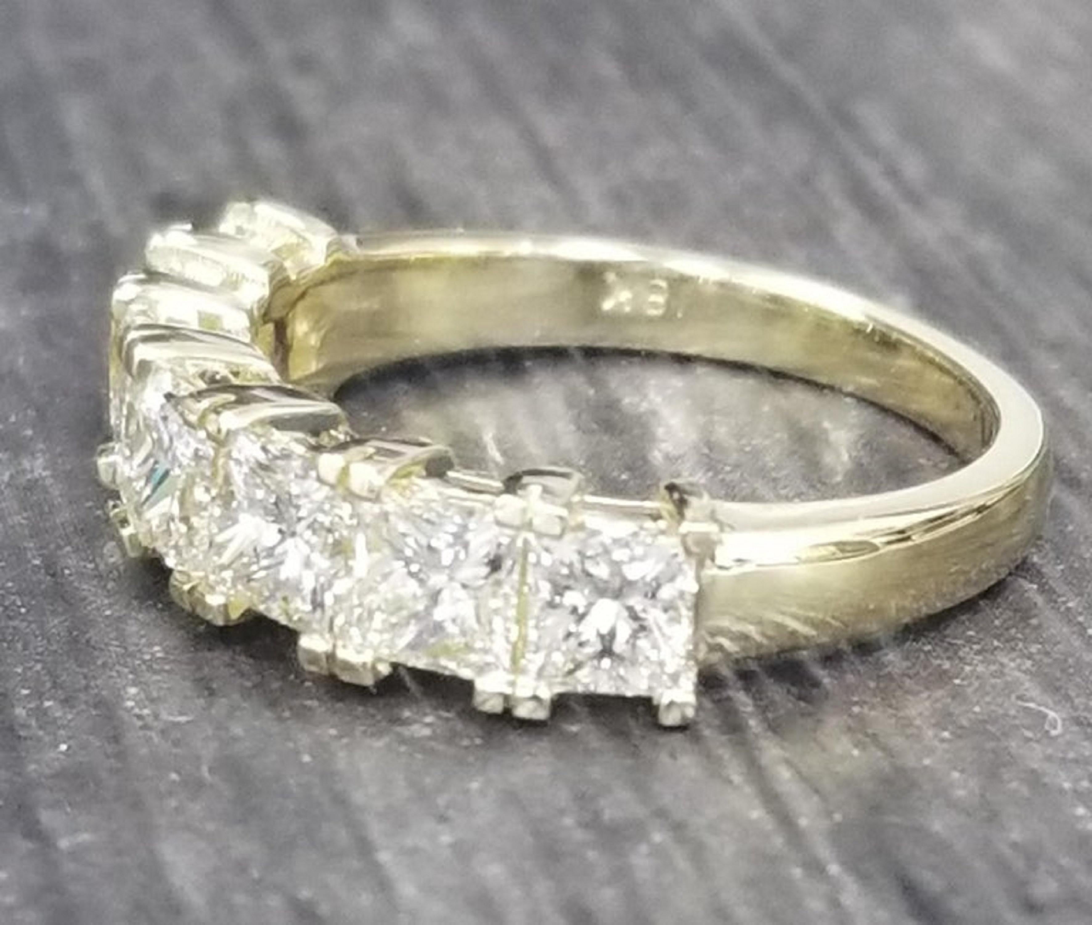 18k yellow gold diamond wedding ring, containing 7 princess cut diamonds of very fine quality weighing 2.30 cts. (average size diamonds.32pts.)