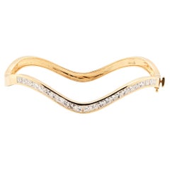 Bracelet en or jaune 18 carats, diamant taille princesse et fines vagues