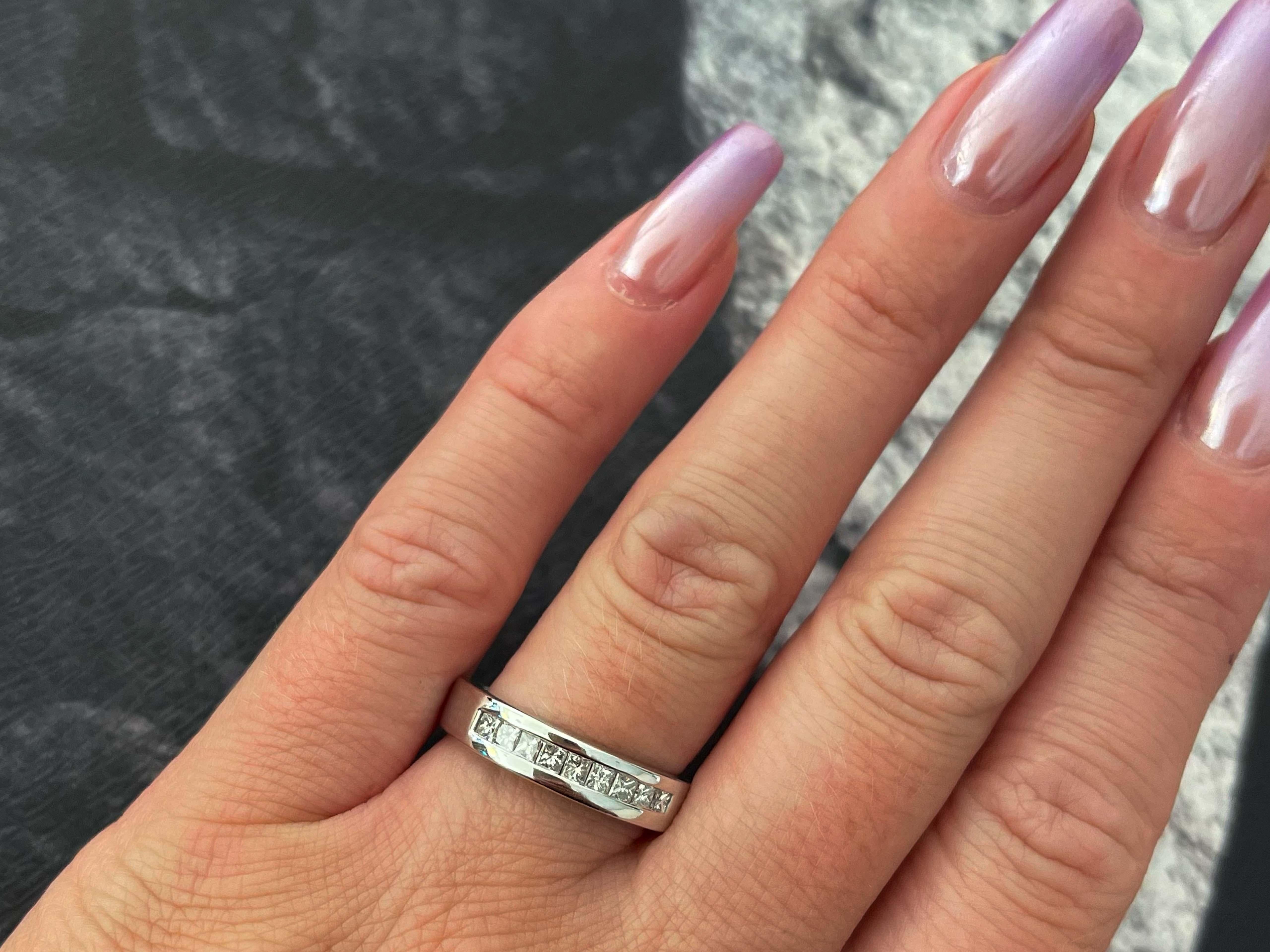 Item Specifications:

Metal: 14k White Gold

Diamond Count: 9 princess cut

Total Diamond Carat Weight: ~0.50 carats 

Diamond Color: I

Diamond Clarity: SI2

Ring Height: ~4.90 mm 

Ring Size: 8.25

Total Weight: 5.6 Grams

Stamped: