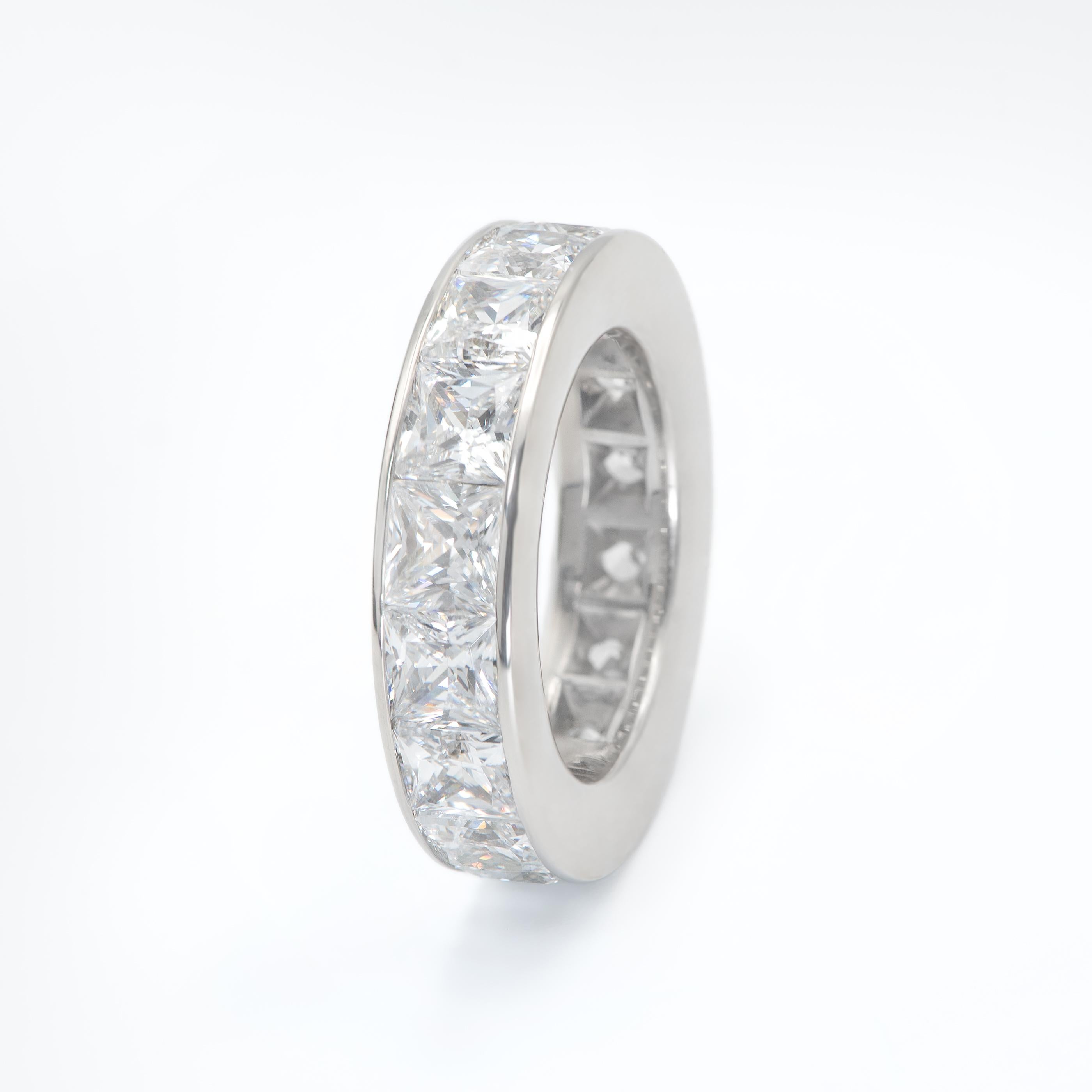 15 Princess Cut Diamonds weighing 7.56 Carats set in a channel set style Eternity Ring.
Each Stone weighs over 0.50 Carats.
Stones are G-H color and VS Clarity. Set in Platinum. Size 5.5.
