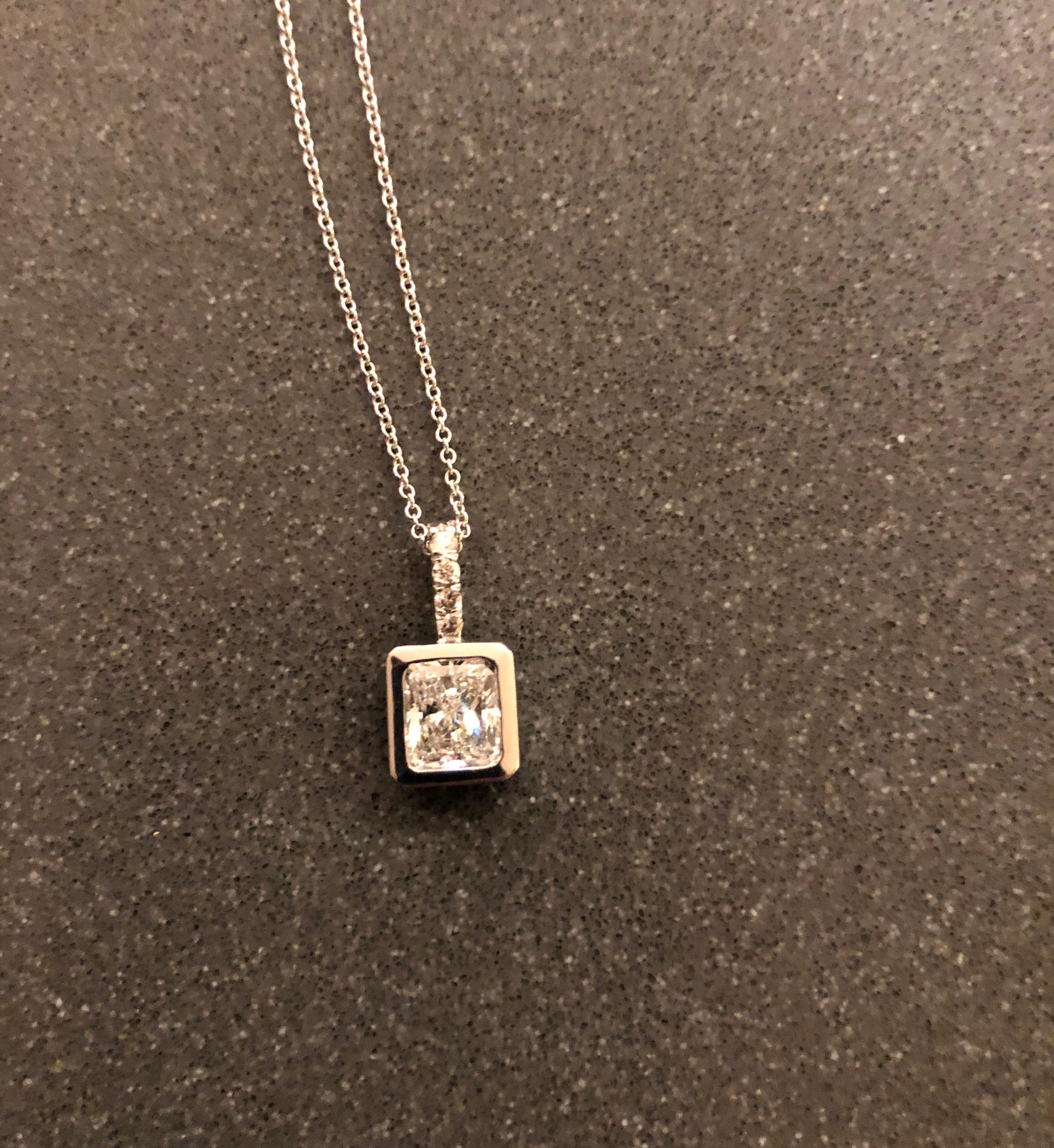 16 inch custom made diamond drop pendant.  Princess Cut Center Stone with Diamonds on the Bale.  14K 1.5CTW Diamond Pendant F-S/I1
 on 18 inch White Gold Chain.