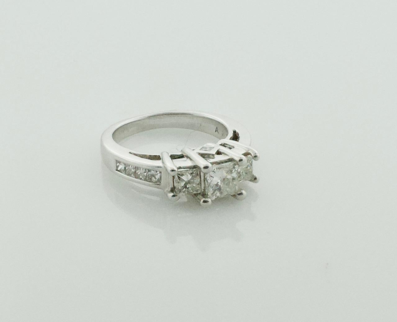 One Princess Cut Diamond Weighing .55 Carats Approximately GHI SI [bright with no imperfections visible to the naked eye]
Two Princess Cut Diamonds Weighing .50 Carats Approximately 
Six Princess Cut Diamonds Weighing ..35 Carats Approximately