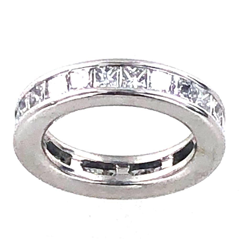 Princess Cut Diamond Eternity Band Ring featuring 26 chanel set diamonds weighing approximately 3.50 carat total weight. The diamonds are graded G-H color and VS clarity. Crafted in 18 karat white gold, the ring is size 6.5 and measures 5mm in