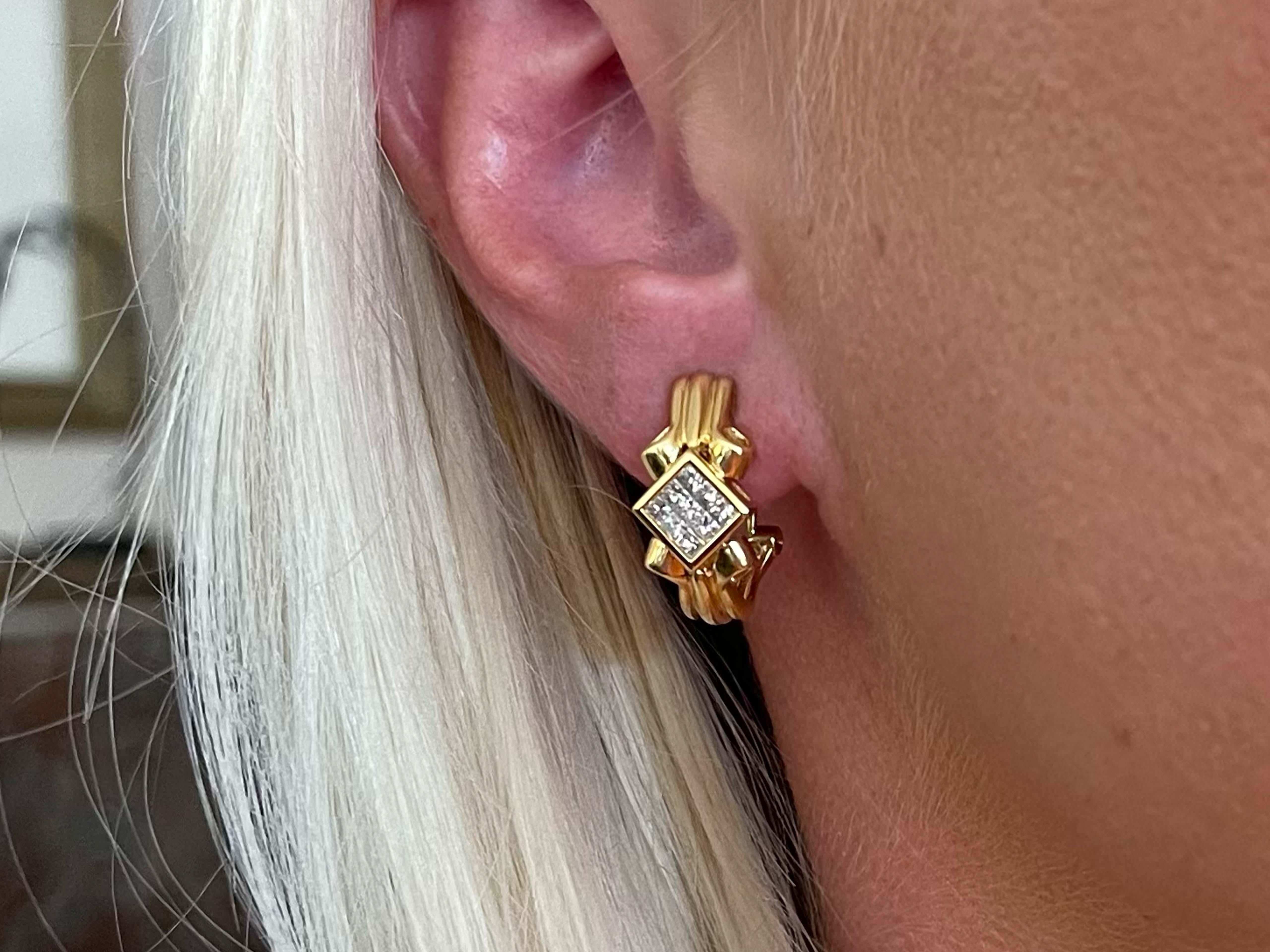 Earrings Specifications:

Metal: 18k Yellow Gold

Earring Measurements: 20.8 x 9.7mm

Total Weight: 9 Grams

Diamonds: 18

Setting: Invisible set

Diamond Color: G

Diamond Clarity: VS2-SI1

Diamond Carat Weight: 0.50 carats

Stamped: