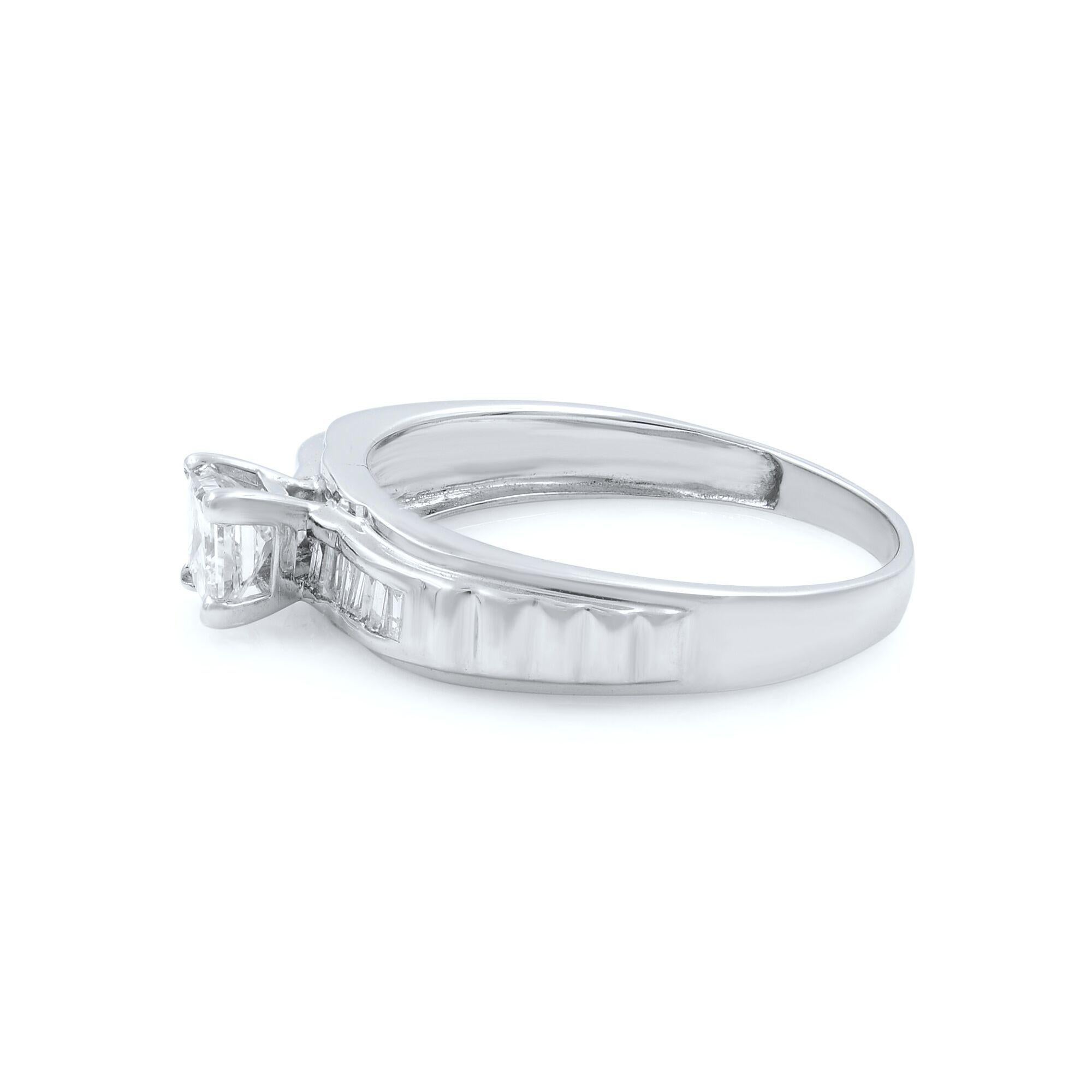 Stunning princess cut diamond ring beautifully set in a very elegant high polished 18K white gold mounting and accented with 14 channel set baguette cut diamonds weighing 0.10ct. The center princess cut stone is Non-Enhanced weighing 0.60ct with