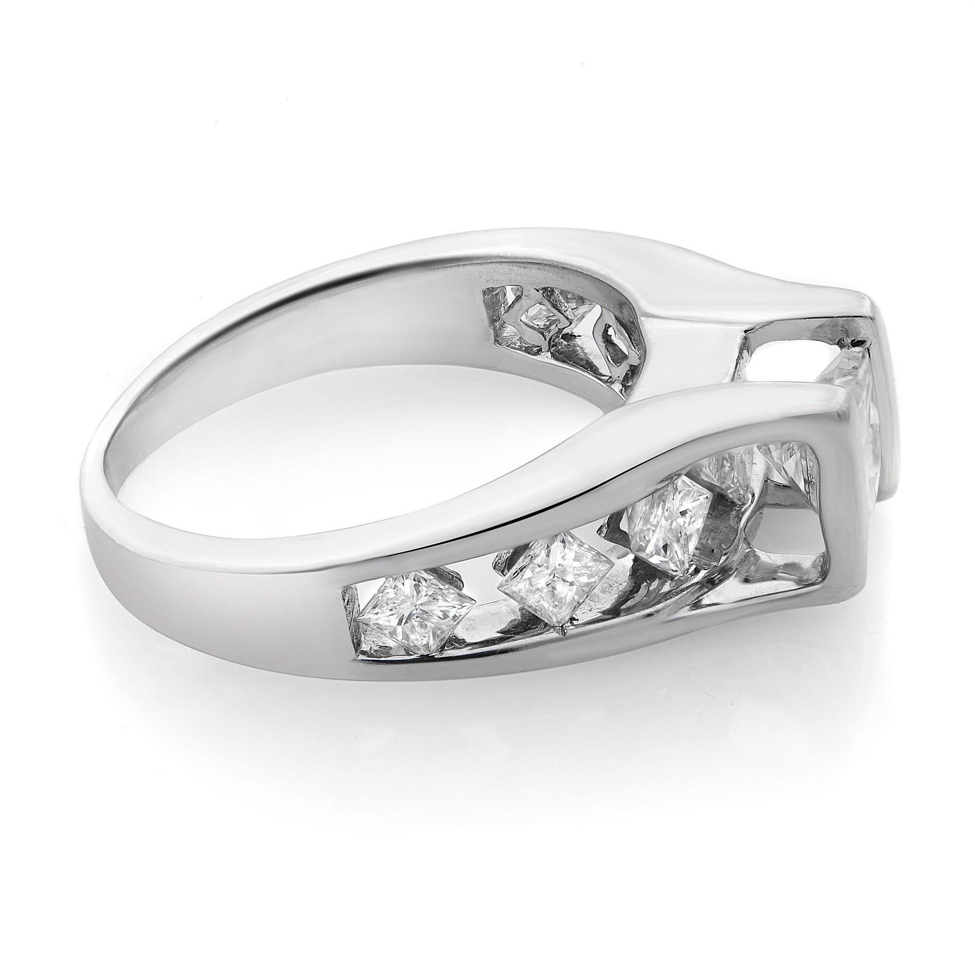 This beautiful ring is crafted 14K white gold. Center stone: apprx. 1.01 cttw princess cut diamond; accents stones: 6 princess cut white diamonds of appx. 1.6 cttw. Total 2.61 Cttw. Diamond color I-J and SI clarity. Size of the ring is 7, total