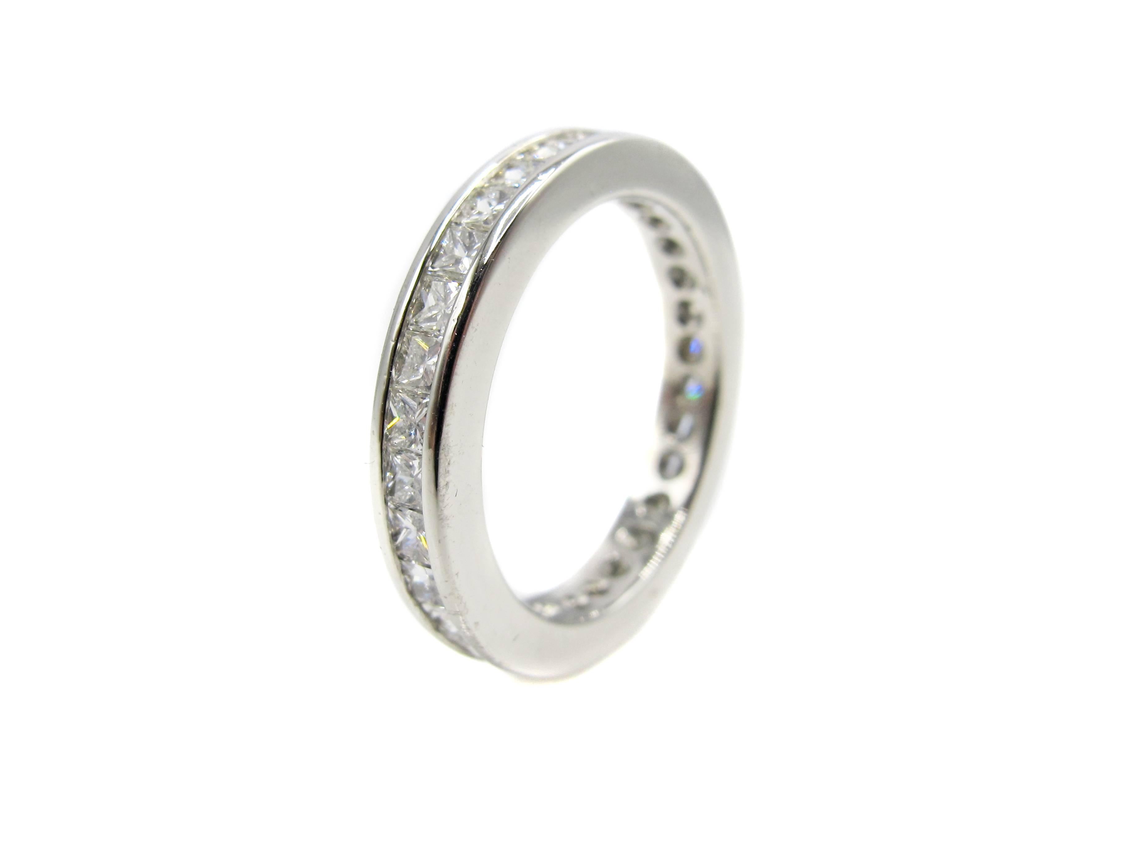 
Finely handcrafted platinum eternity band set with 32 perfectly matched bright white and sparkly princess cut diamonds. The diamonds are bezel set precisely next to each other with no spaces showing, giving the appearance of flowing river of white.