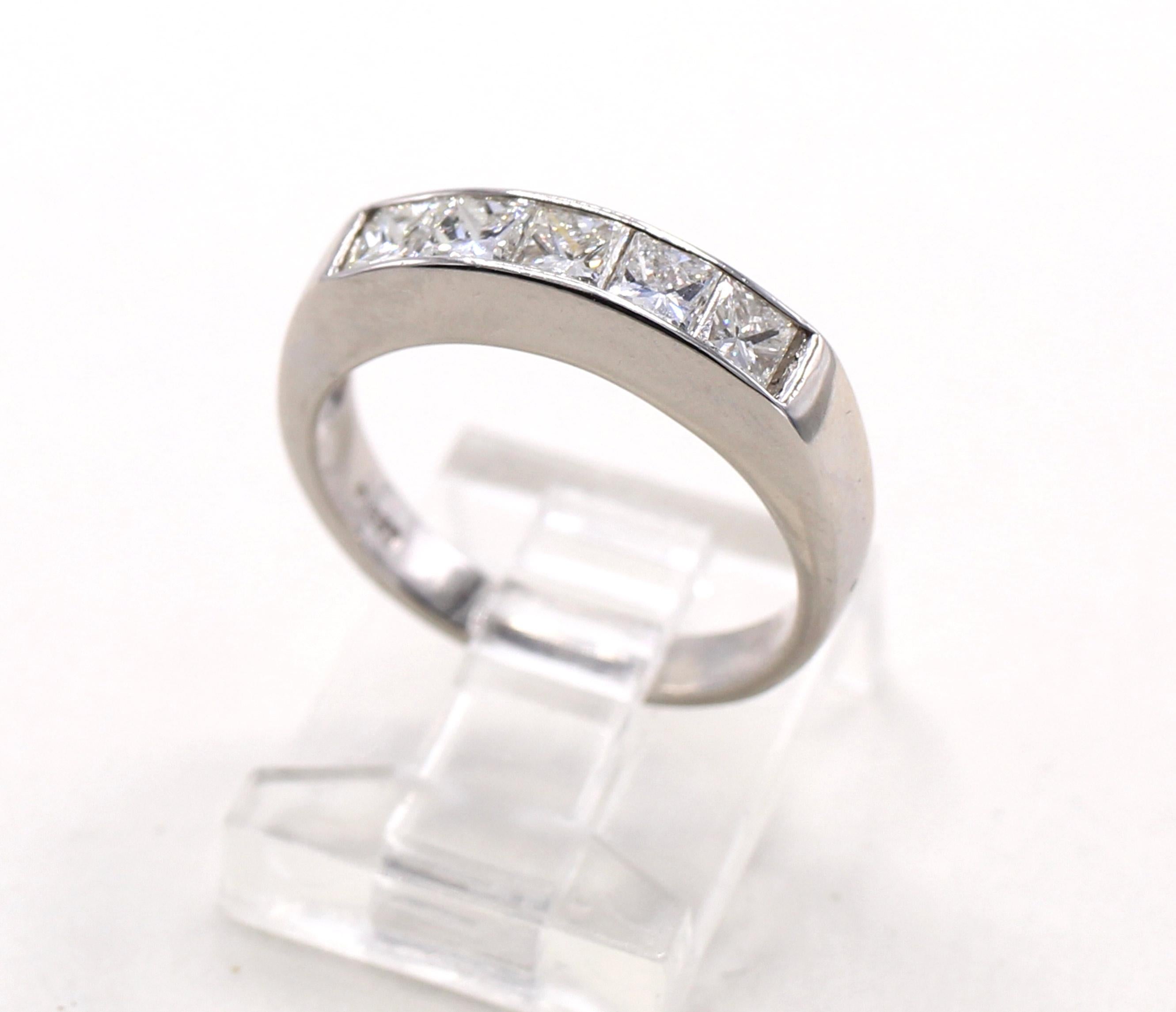 5 Princess cut diamonds with a total weight of 1.02 carats are channel set in a platinum handmade band. The average color and clarity of the diamonds is G/H VS. Size 6.5, can be sized