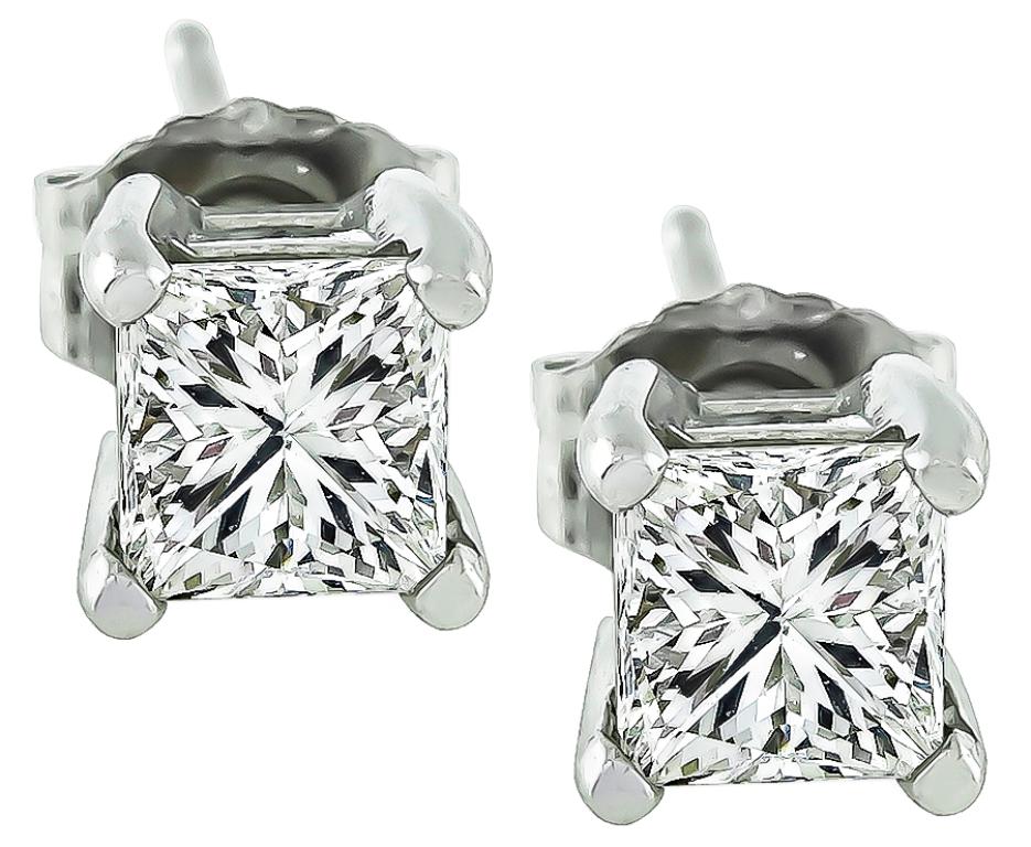 This charming pair of diamond platinum earrings are set with sparkling princess cut diamonds that weigh approximately 0.90ct total weight. graded I color with SI1 clarity. 
The earrings measure 5mm by 5mm and weigh 1.5 gram.


Inventory #26920WBS