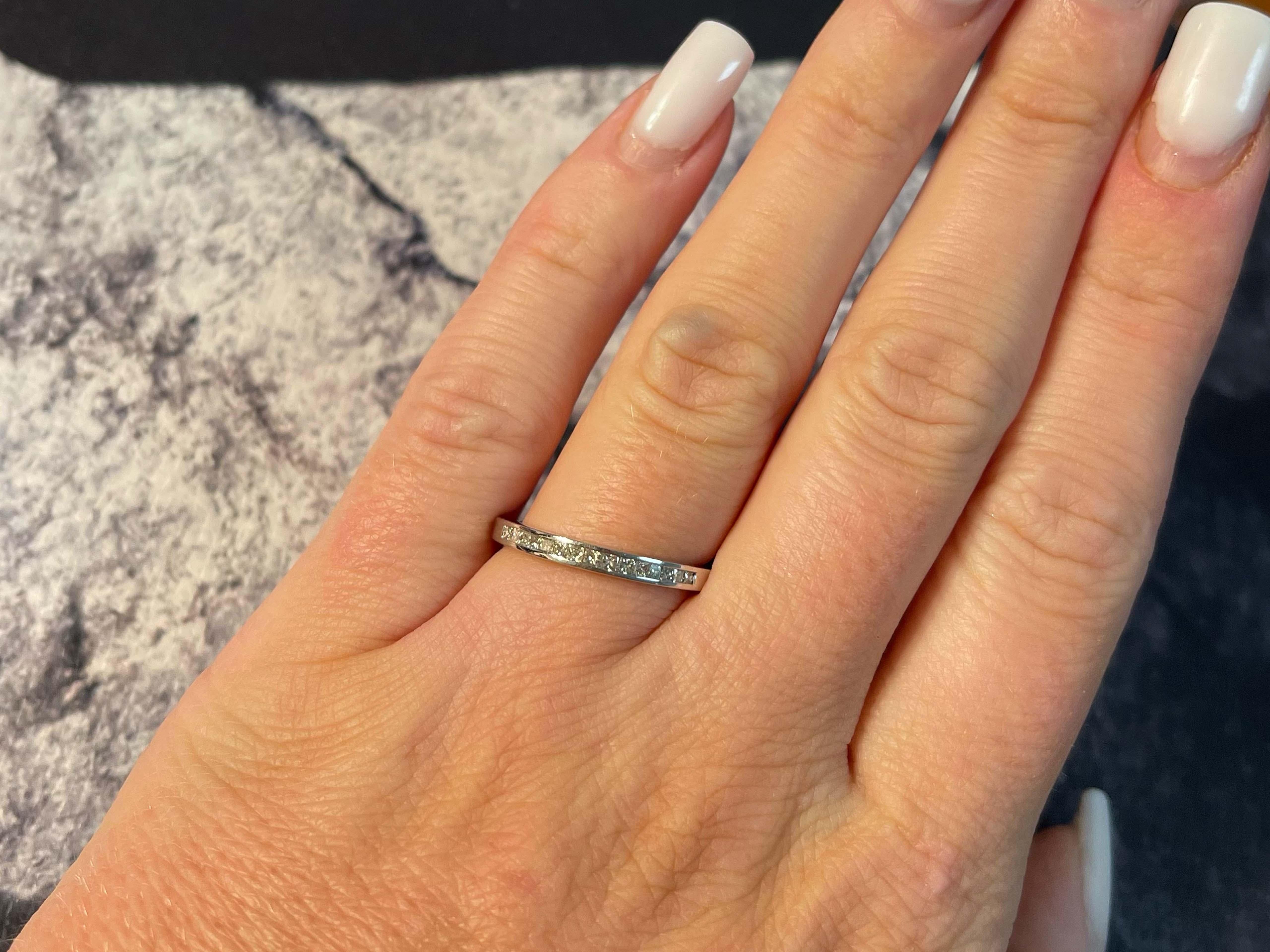 Item Specifications:

Metal: 14k White Gold

Diamond Count: 15 princess cut

Total Diamond Carat Weight: 0.36 carats 

Diamond Color: H

Diamond Clarity: SI

Ring Size: 6.75

Total Weight: 2.4 Grams

Stamped: 